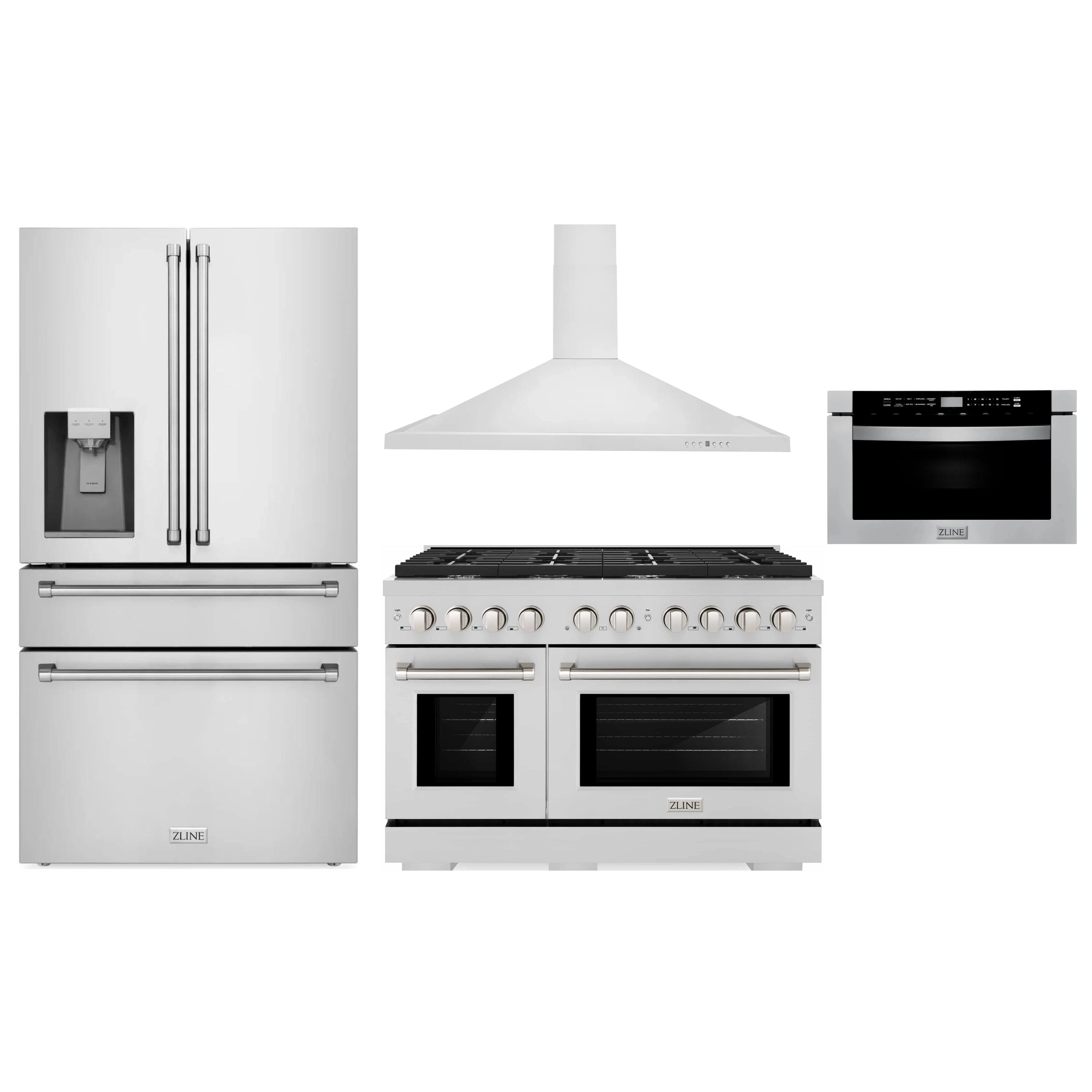 Stainless steel gas range with matching hood and refrigerator side-by-side