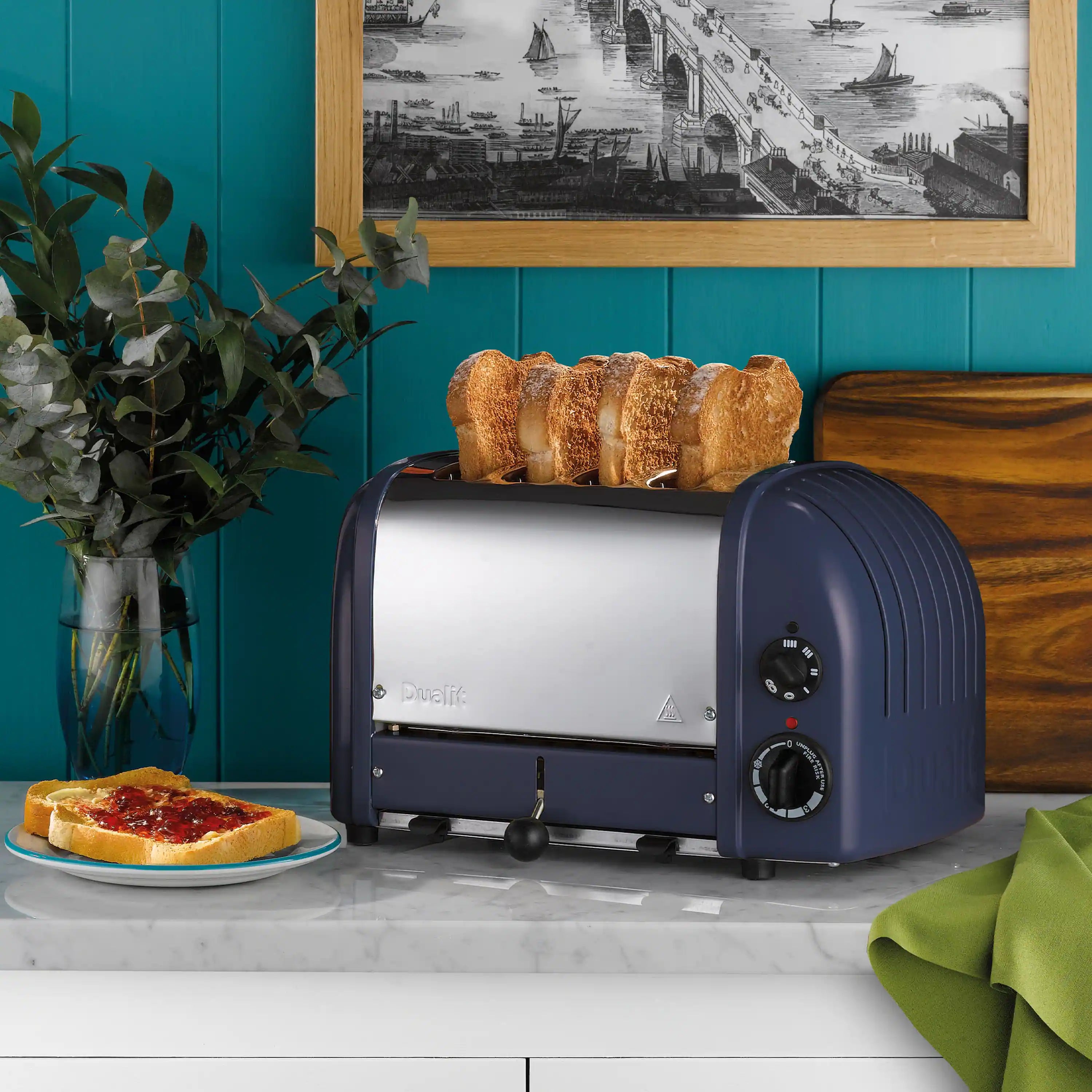 Lavender-blue Dualit 4-slice toaster with control knobs and front lever