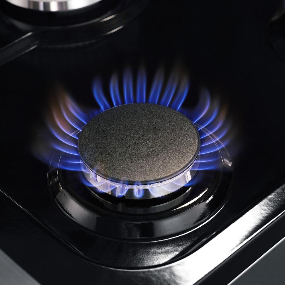Gas burner with blue flame centered under a dark griddle-like cap