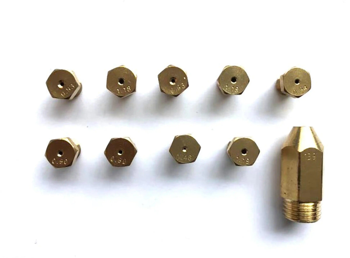 Dual fuel range burner orifices and brass gas nozzle tips