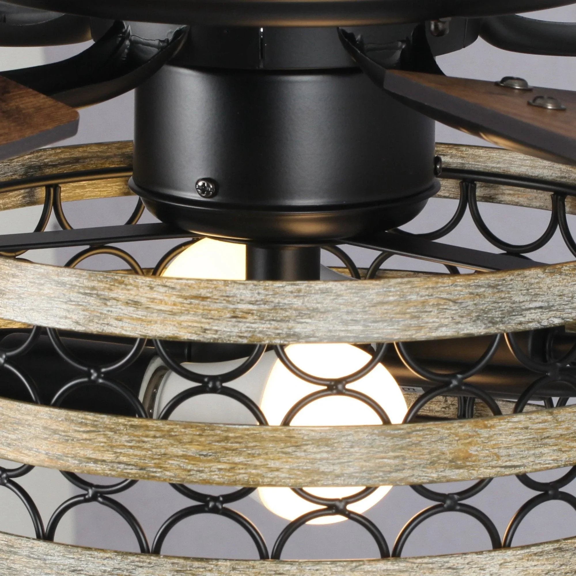 Decorative ceiling fan light kit with amber glow and black metal cage