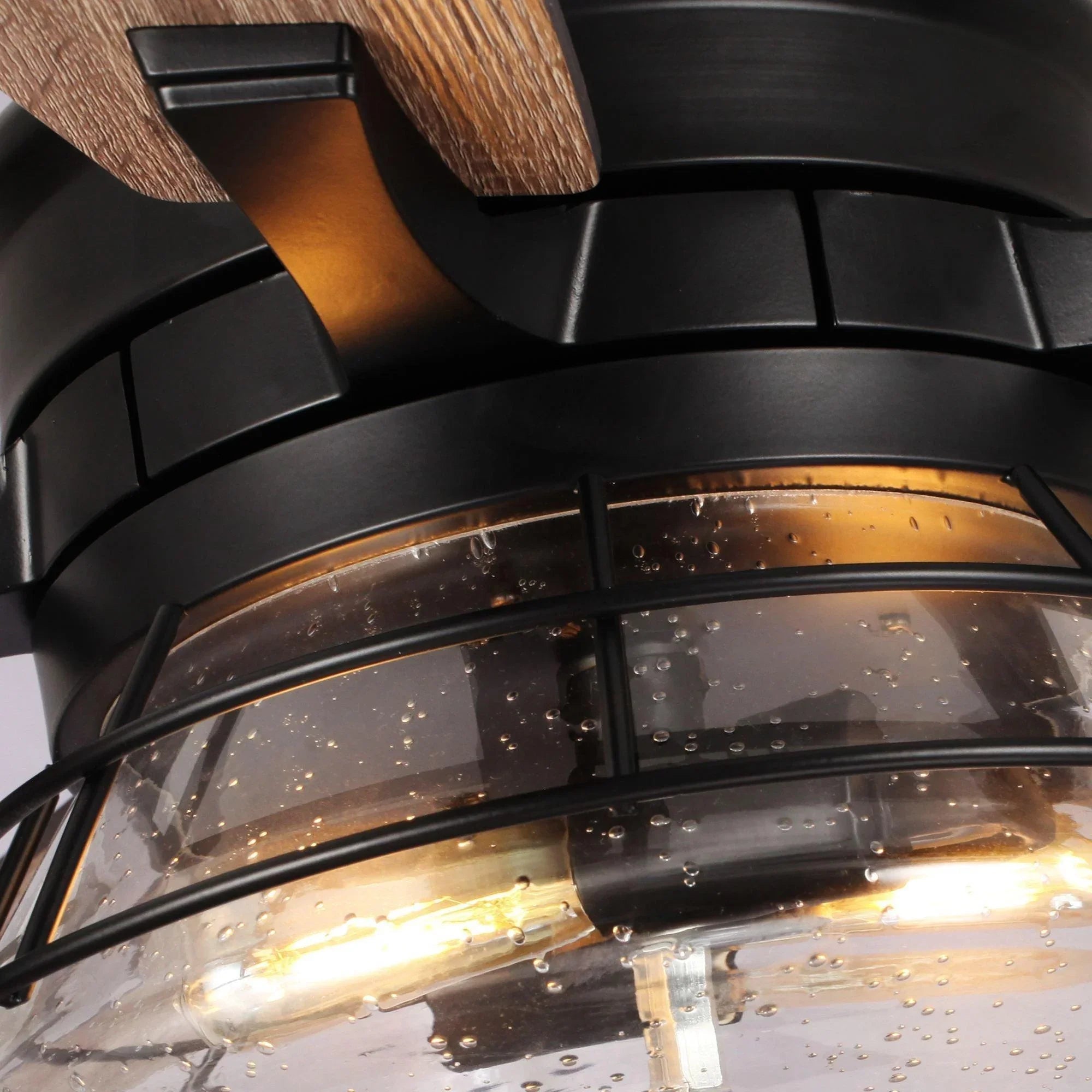 Ceiling fan light with clear glass globe and black protective cage