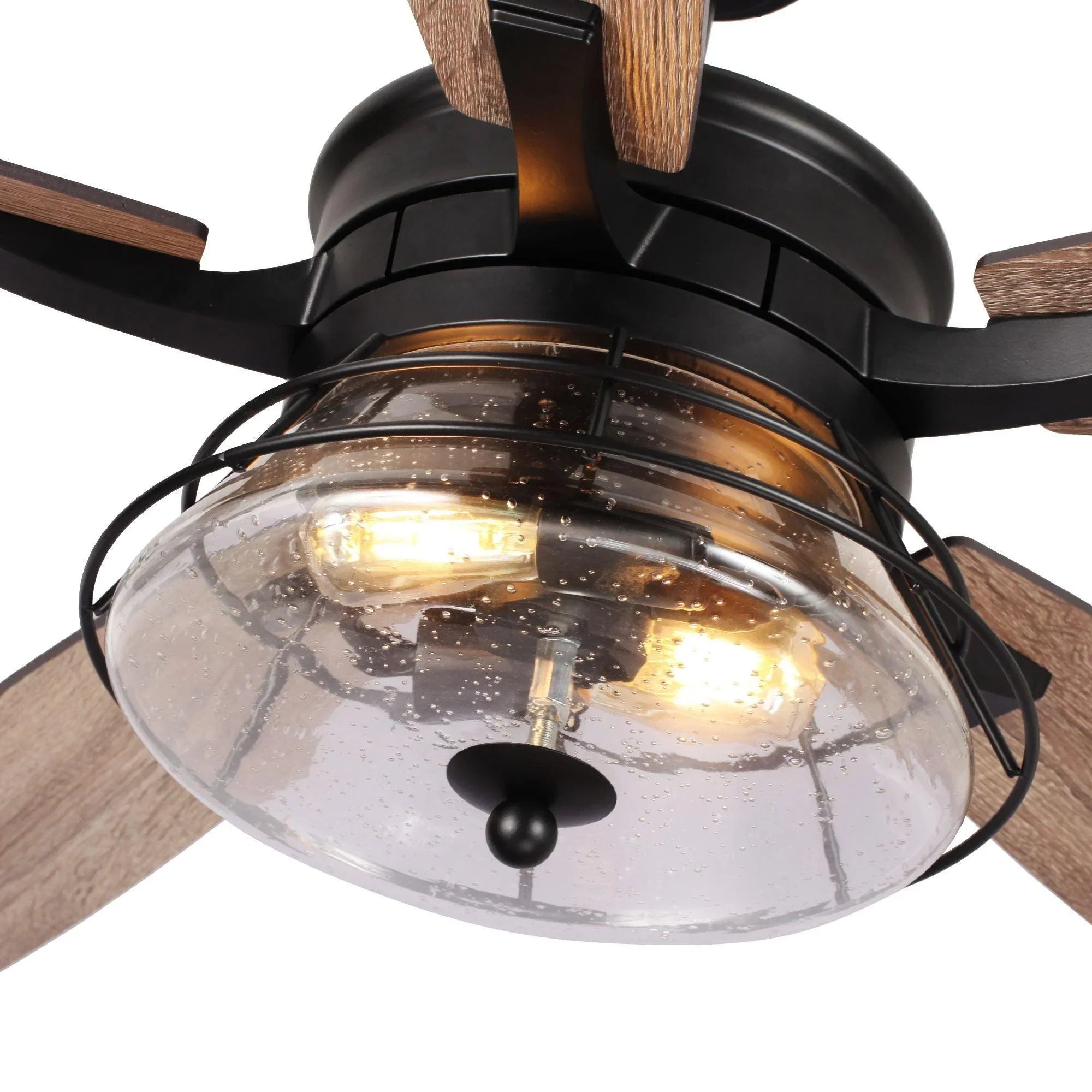 Close-up ceiling fan with wood blades and glowing clear glass light