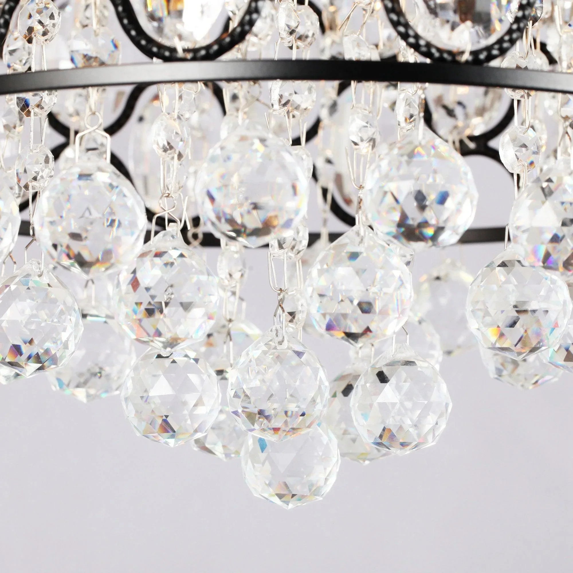 Faceted crystal chandelier-style ceiling fan light with hanging clear prisms