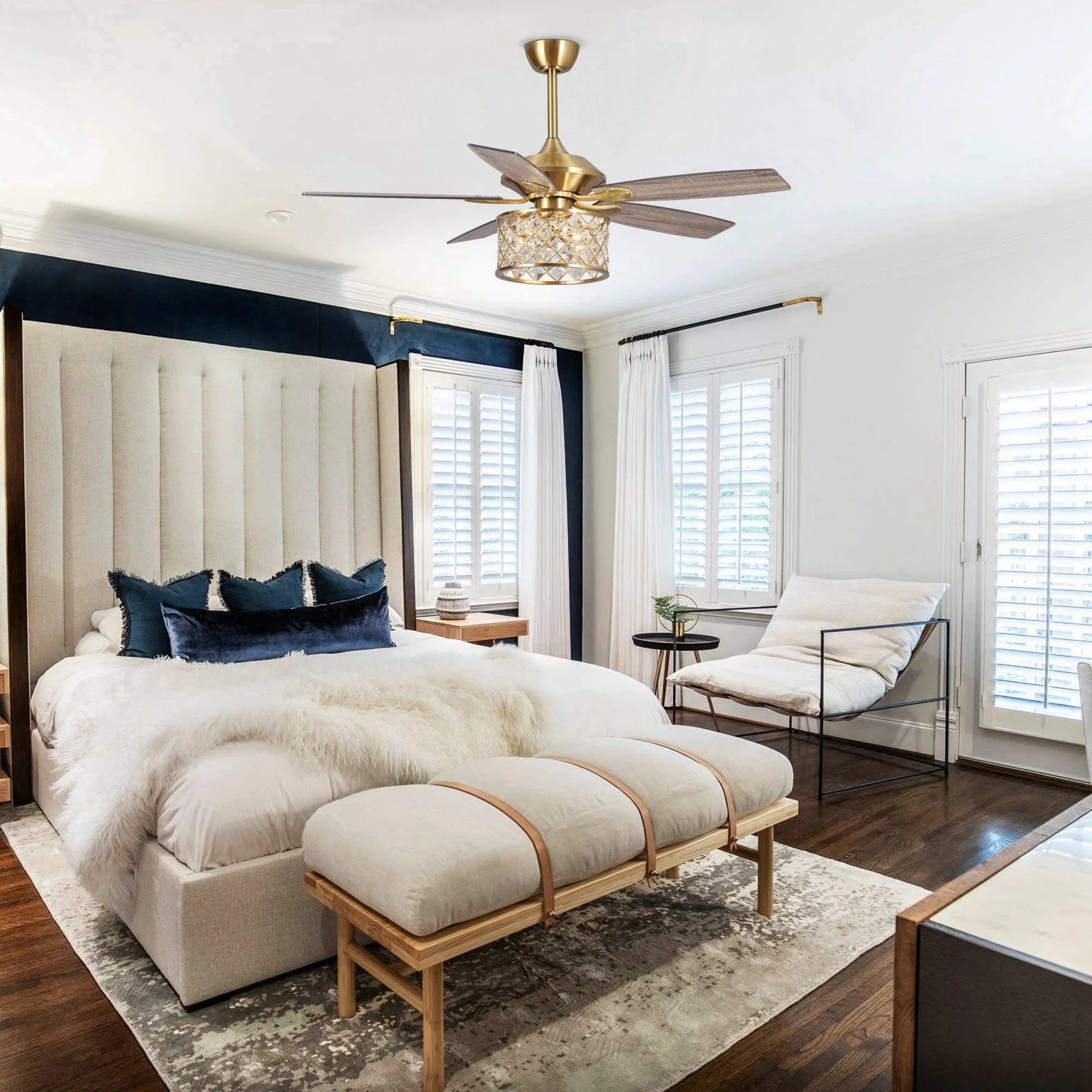 Golden ceiling fan with crystal light fixture and reversible dark wood blades