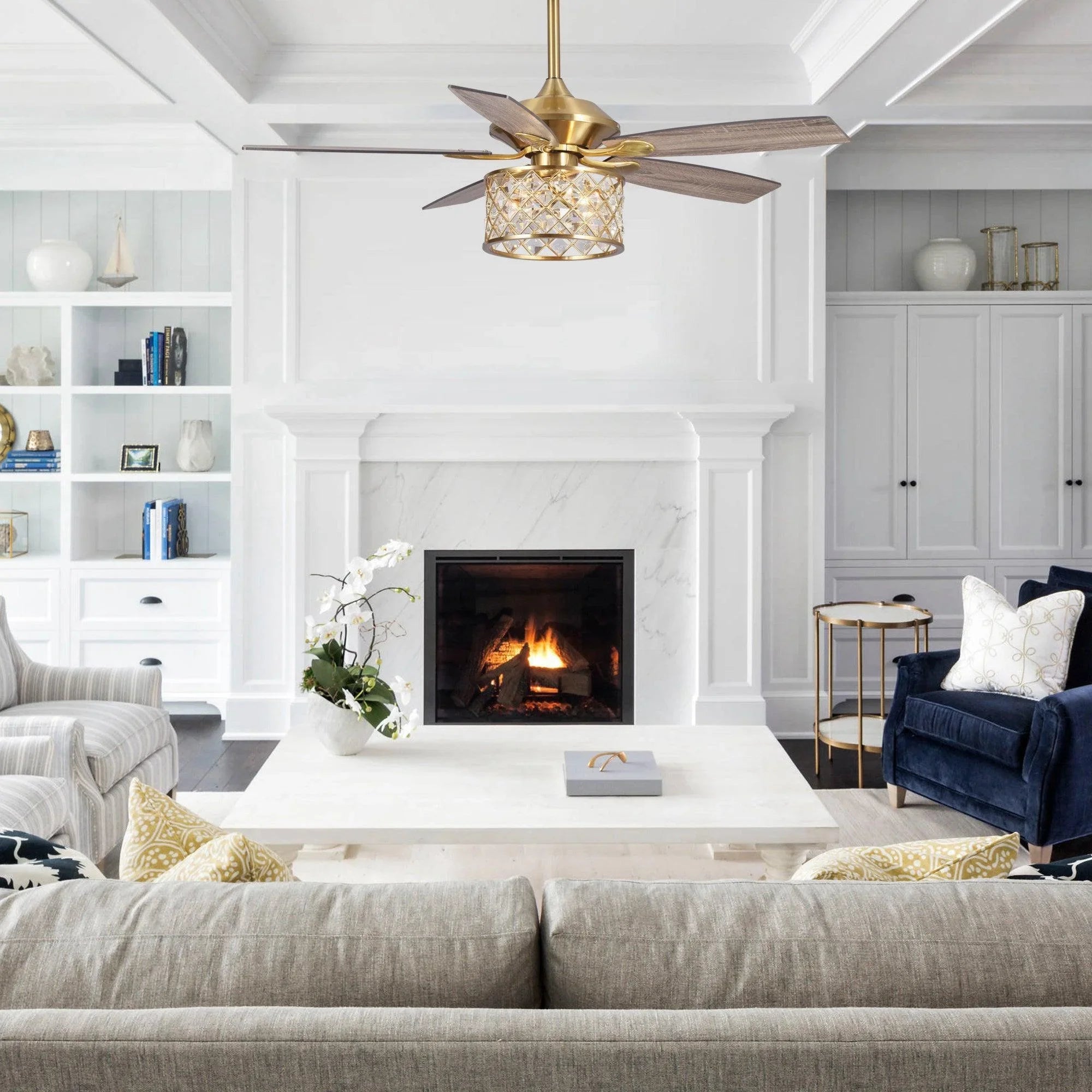 Golden ceiling fan with crystal light housing and dark wood blades