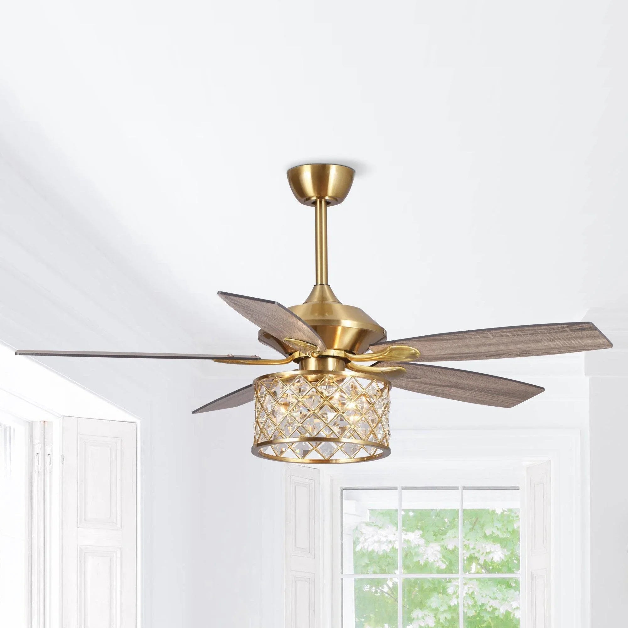 Golden ceiling fan with crystal drum light and dark wood reversible blades