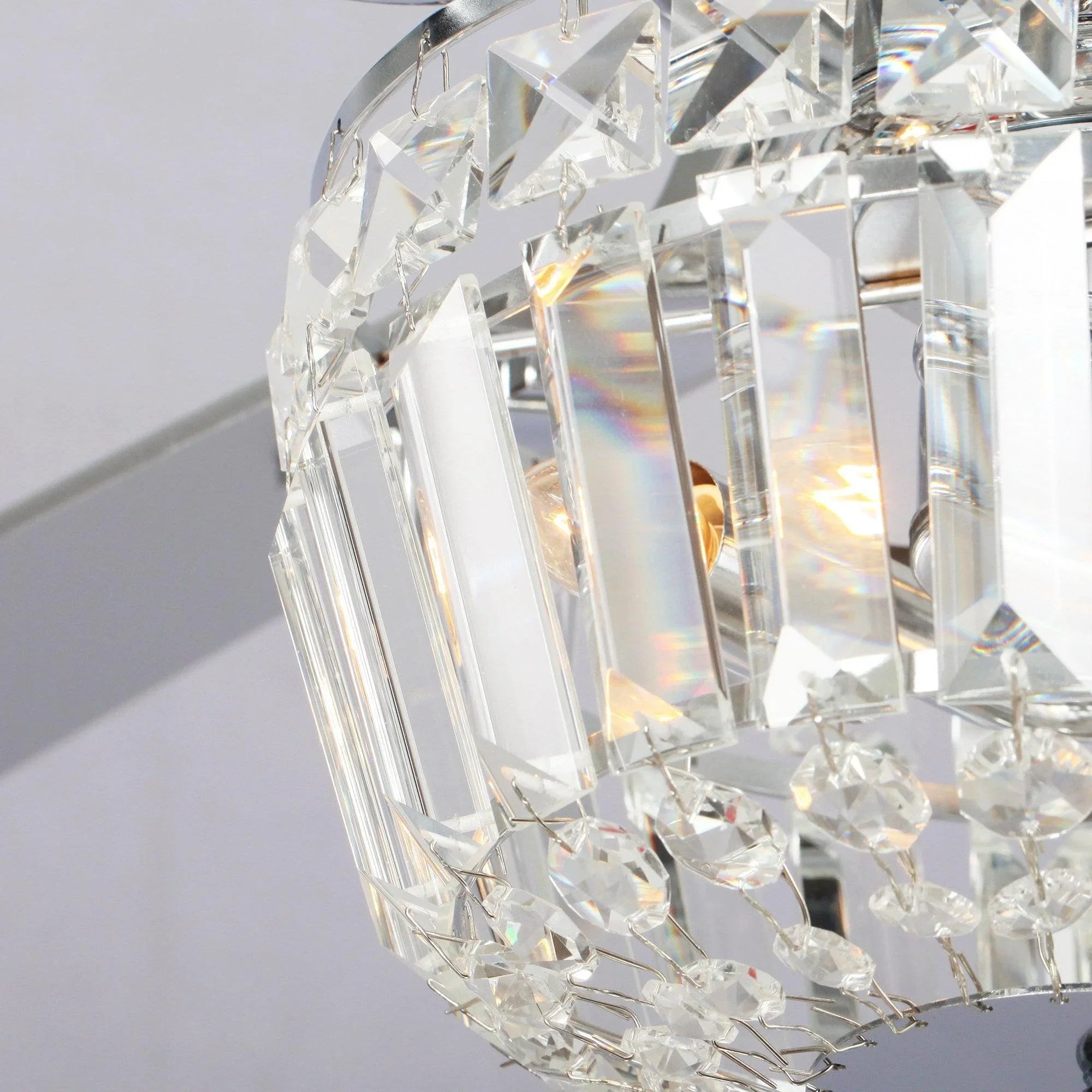 Crystal light shade with faceted glass prisms on a ceiling fan