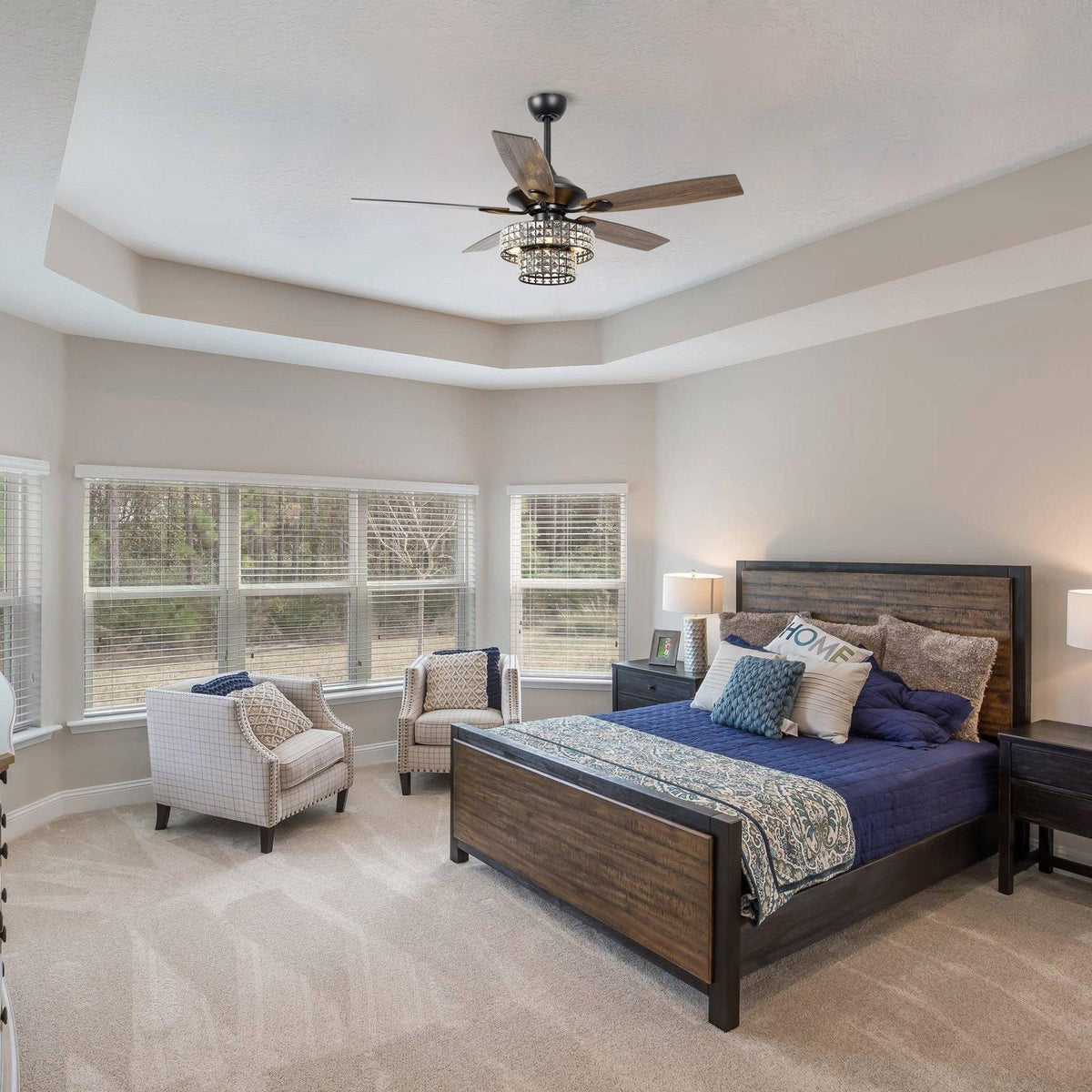 Black ceiling fan with wood blades and crystal glass light fixture