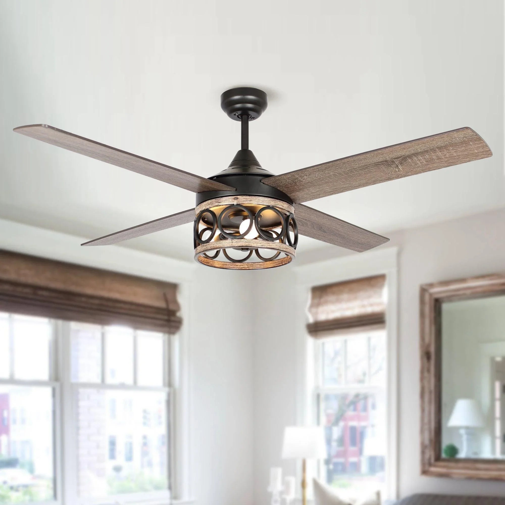 Black ceiling fan with four wood blades and ornate lantern light on ceiling.