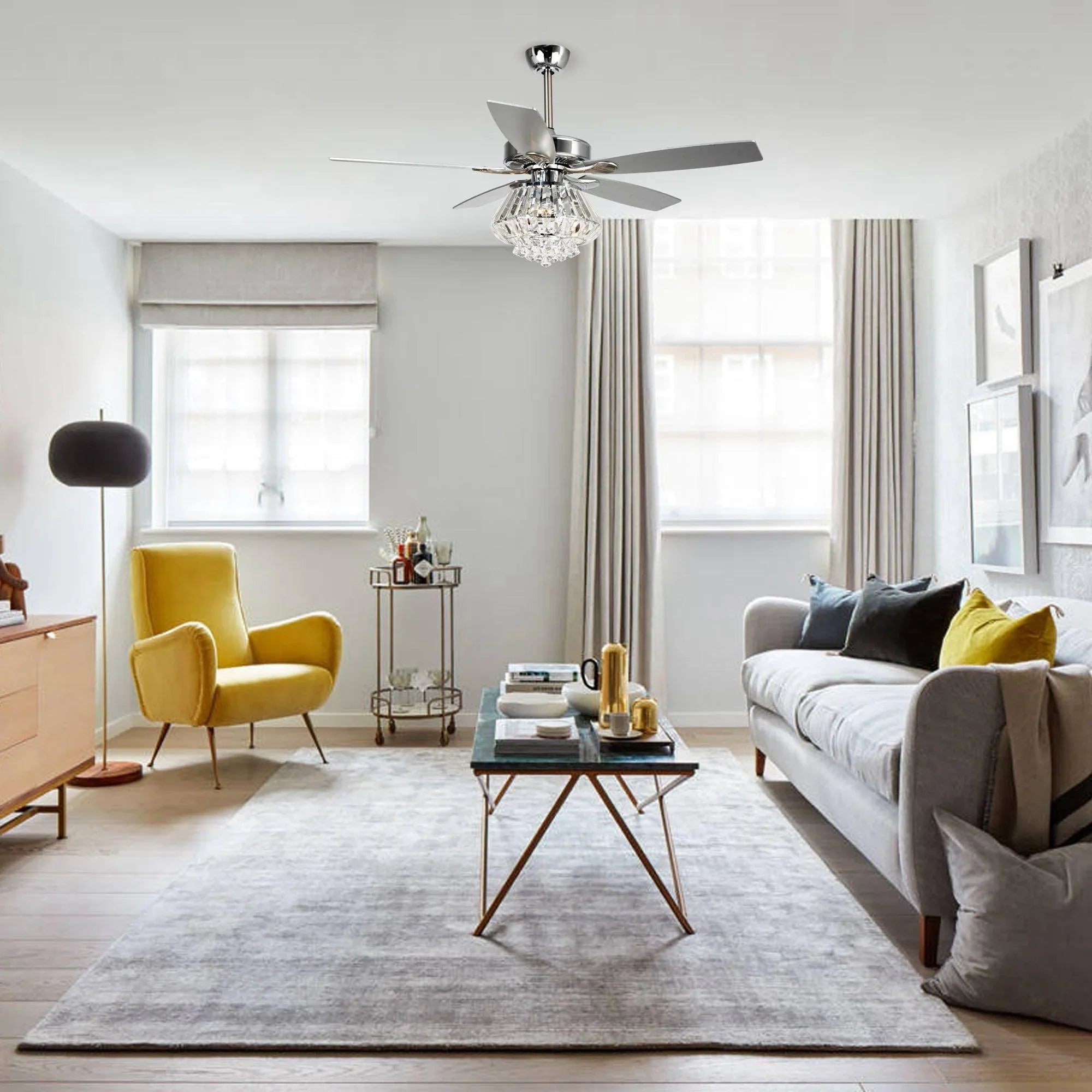Chrome ceiling fan with crystal light and four reversible blades overhead