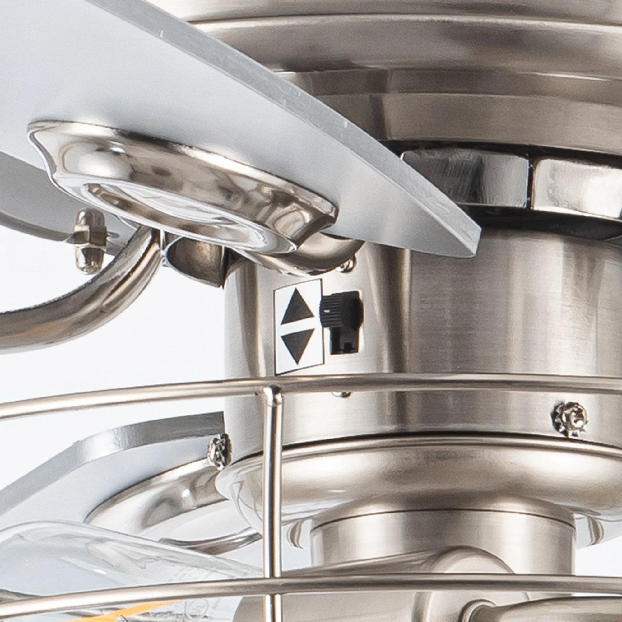 Brushed nickel ceiling fan motor housing with light mount and control switch details