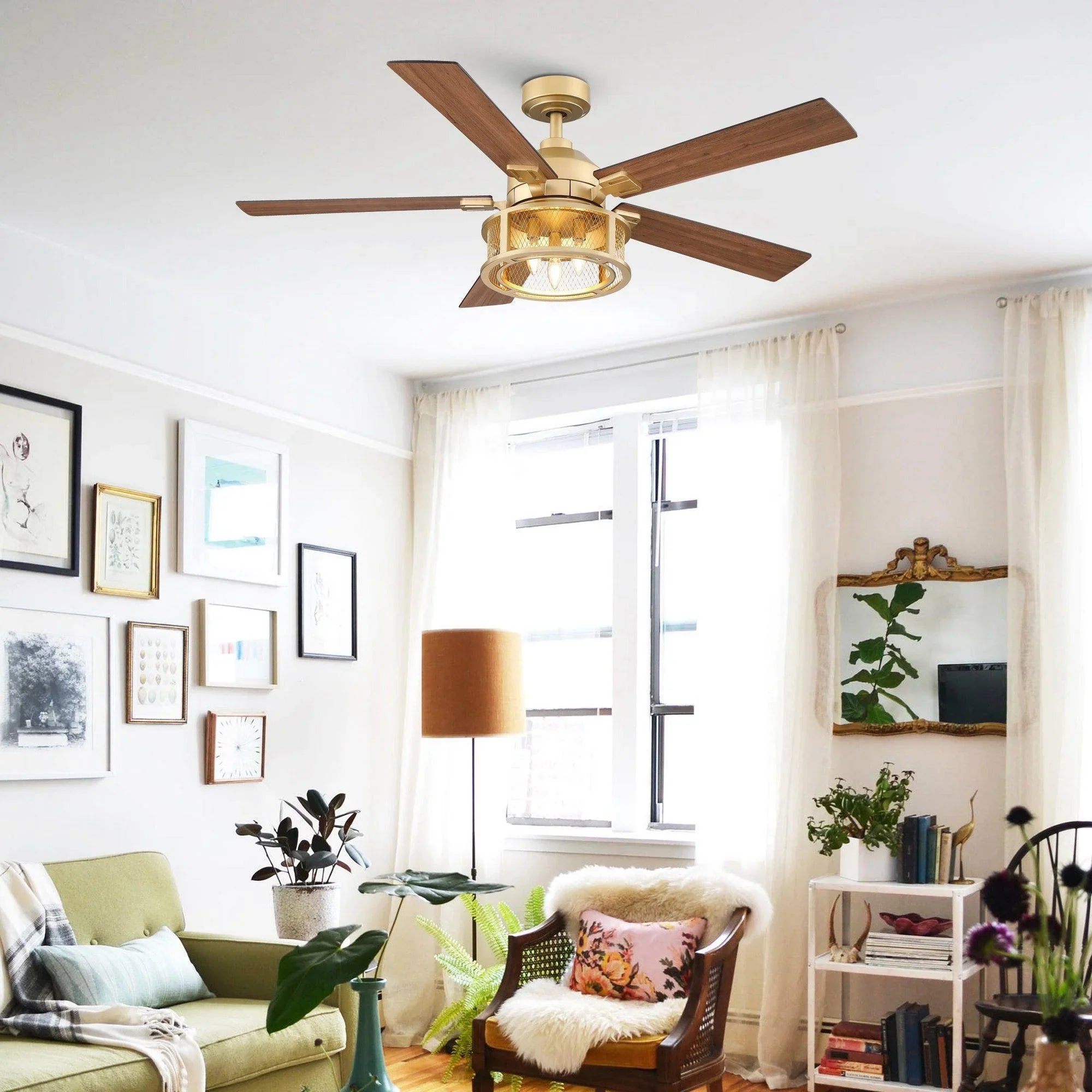 Ceiling fan with brown blades, gold motor housing, and round light fixture