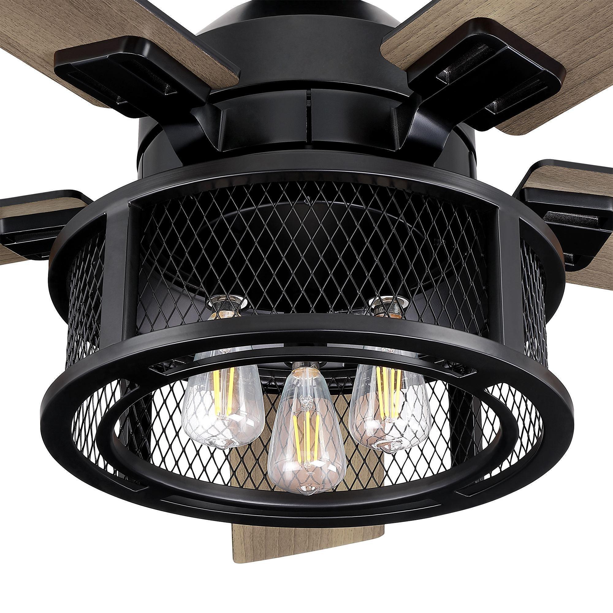 Black ceiling fan motor housing with mesh light guard and exposed bulbs, five wood blades