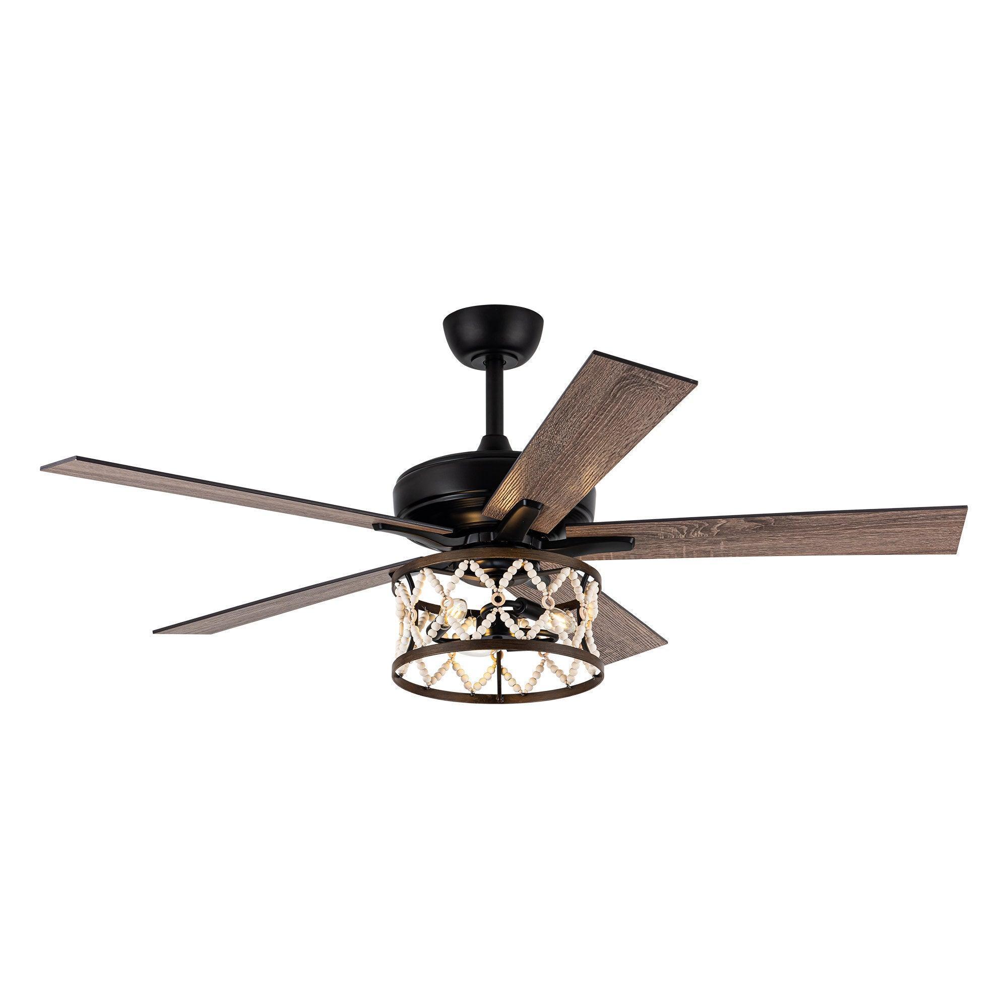 Ceiling fan with black housing, wood-toned reversible blades, and decorative cage light