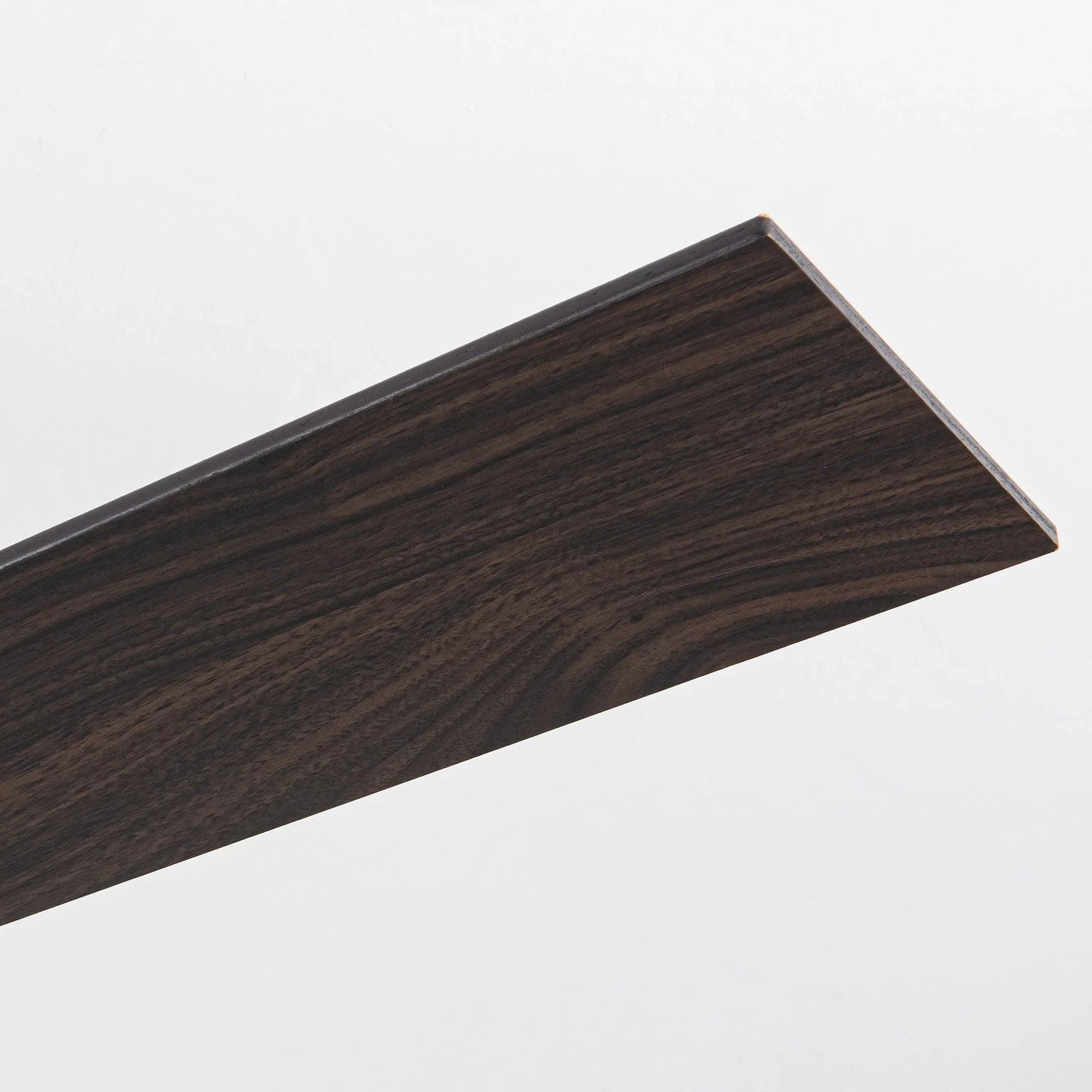 Reversible fan blade in dark wood tone, with smooth textured finish.