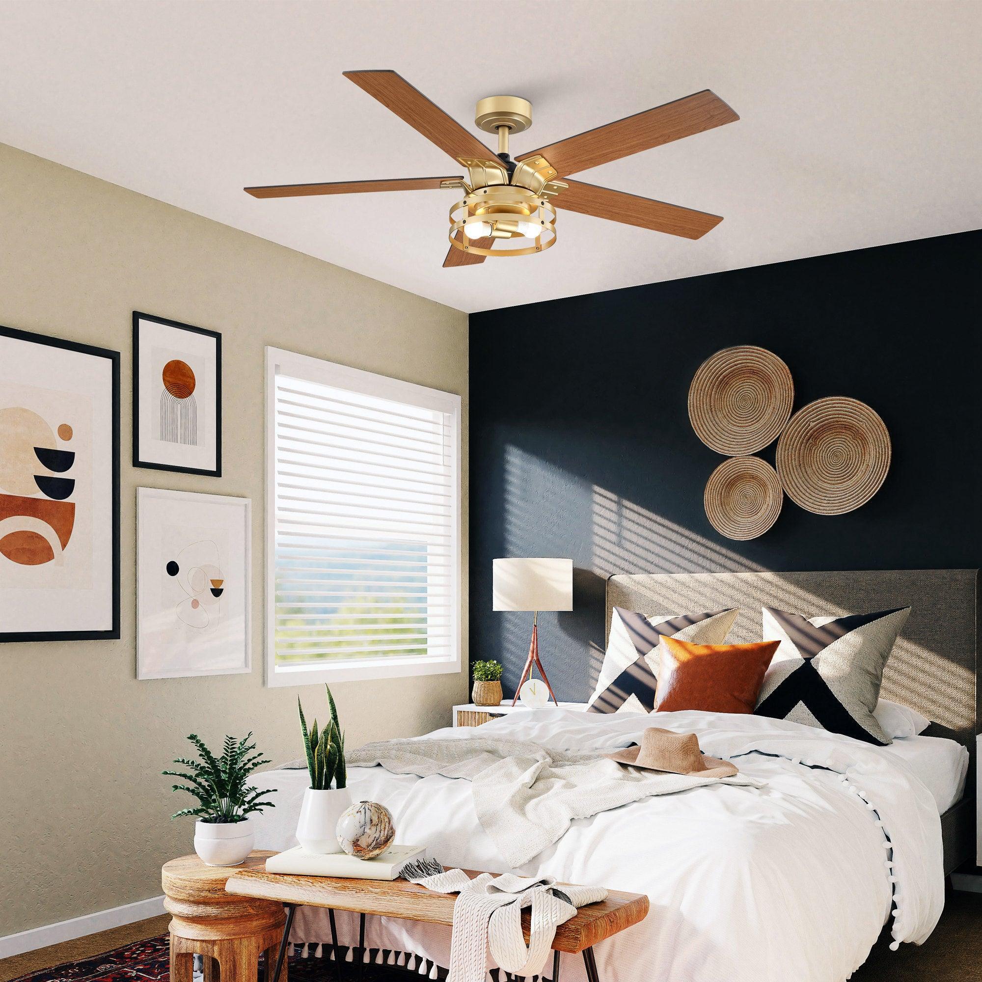 Industrial ceiling fan with light kit and four wood blades, downrod mount, golden finish.