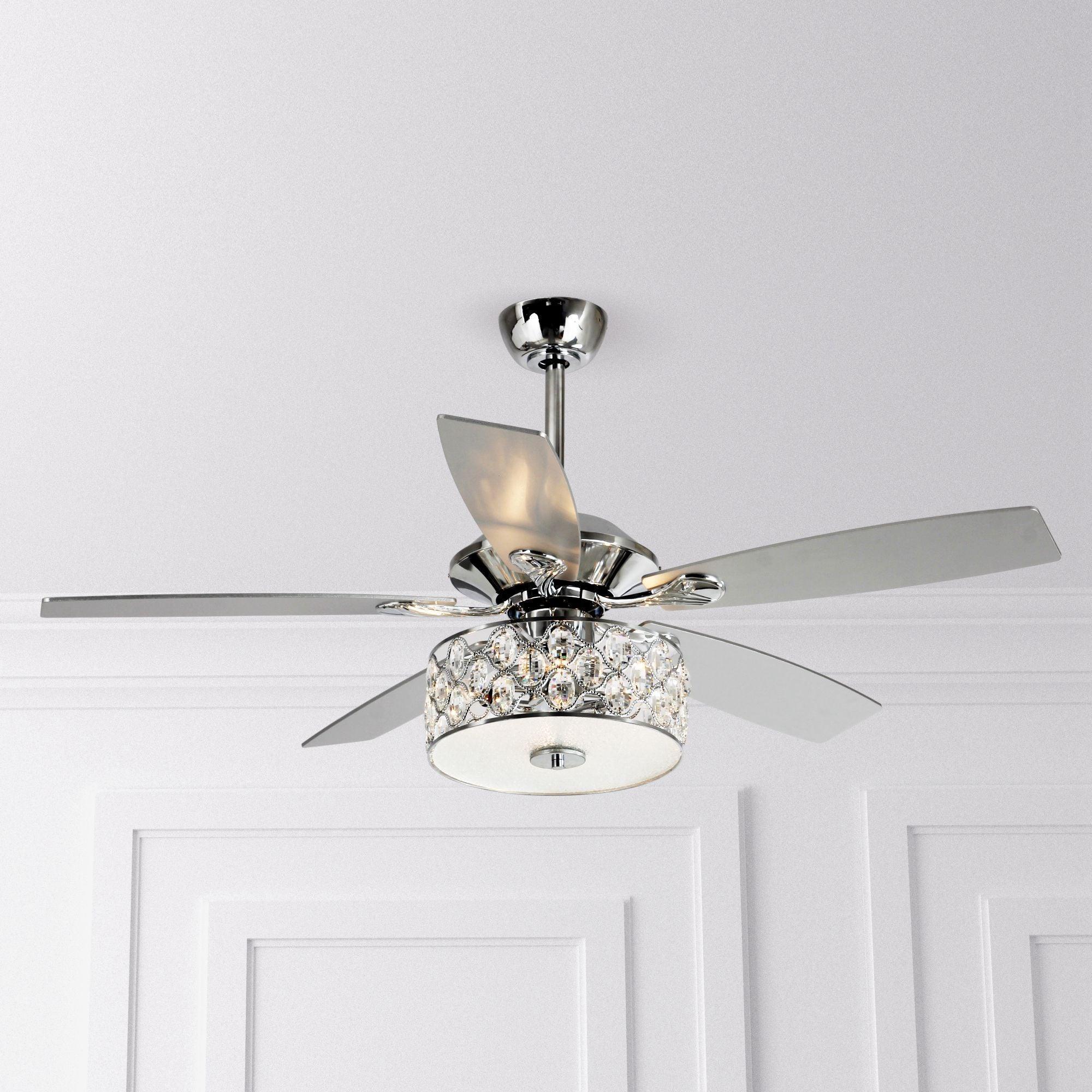 Chrome ceiling fan with crystal lamp light and silver blades against a white ceiling