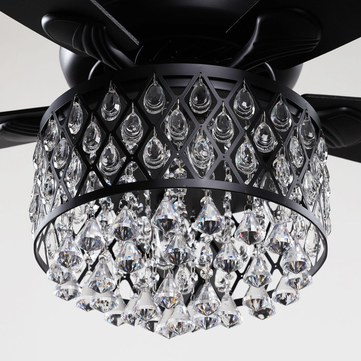 Crystal chandelier light with black lattice frame mounted on black ceiling fan