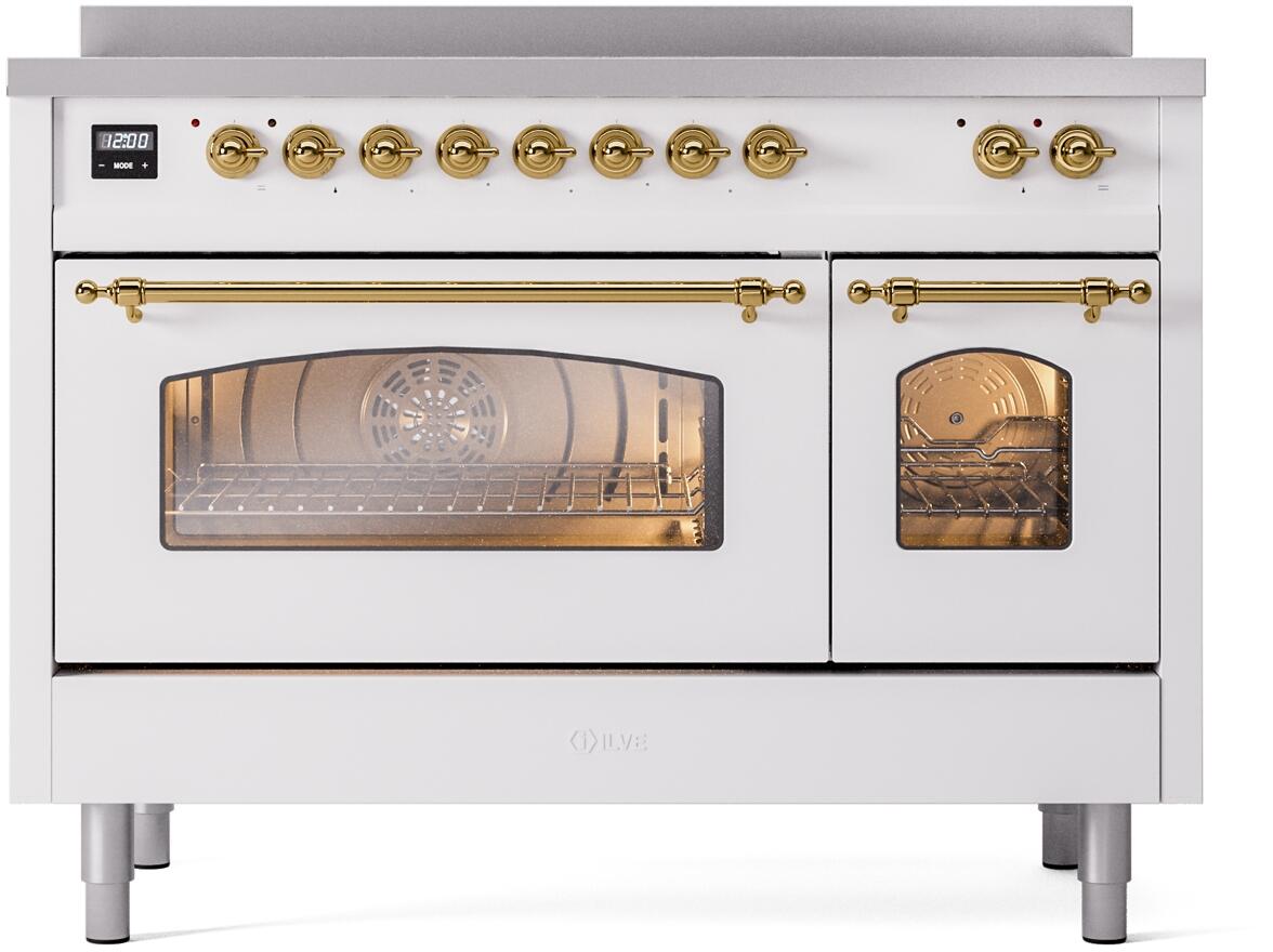 White range with brass knobs and handle, glass window showing empty oven cavity