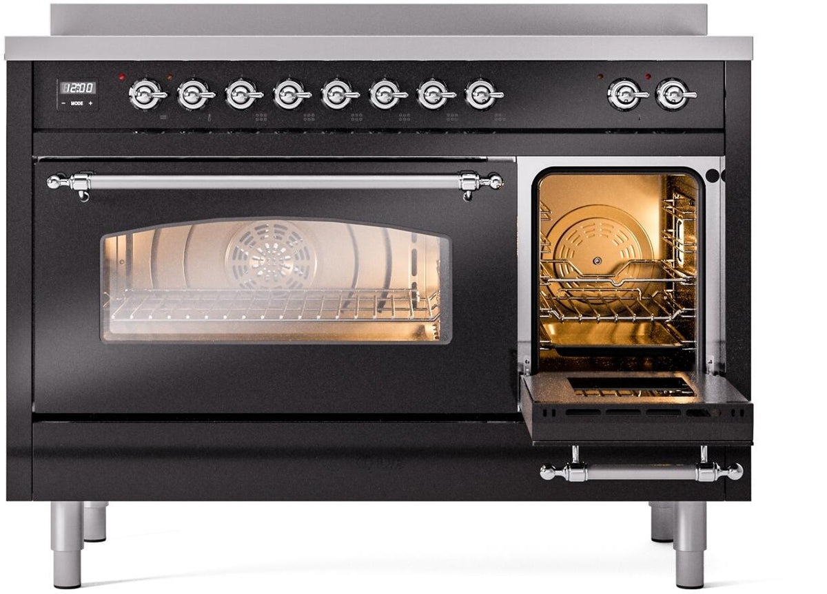 Freestanding induction range with oven door open and oven light glowing inside