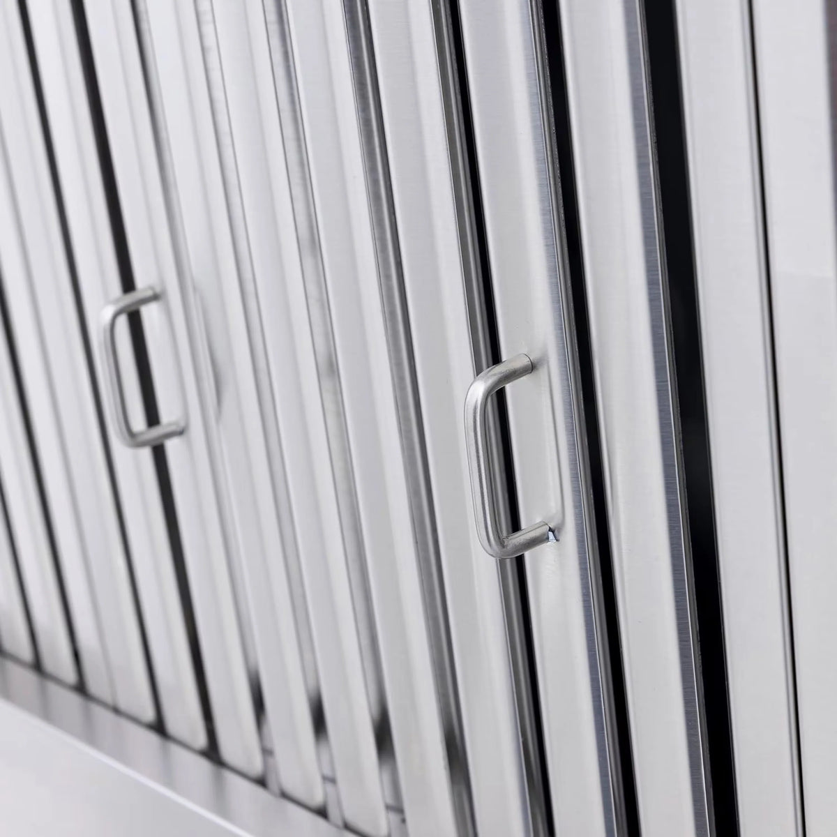 Louvered vent hood side panel with metal pull handles
