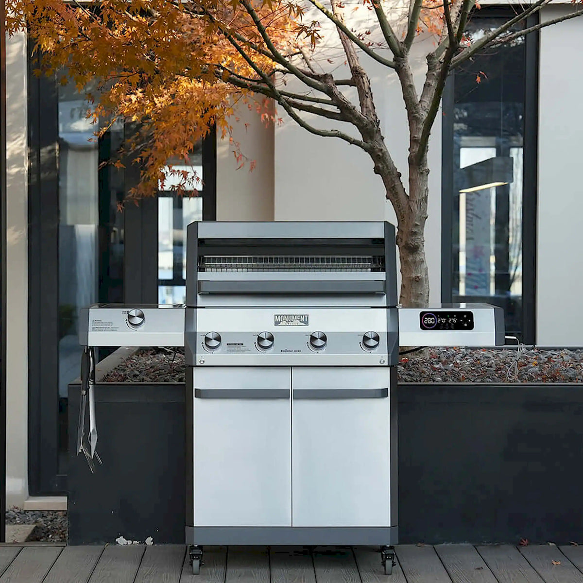 Stainless steel propane gas grill with double doors and warming rack
