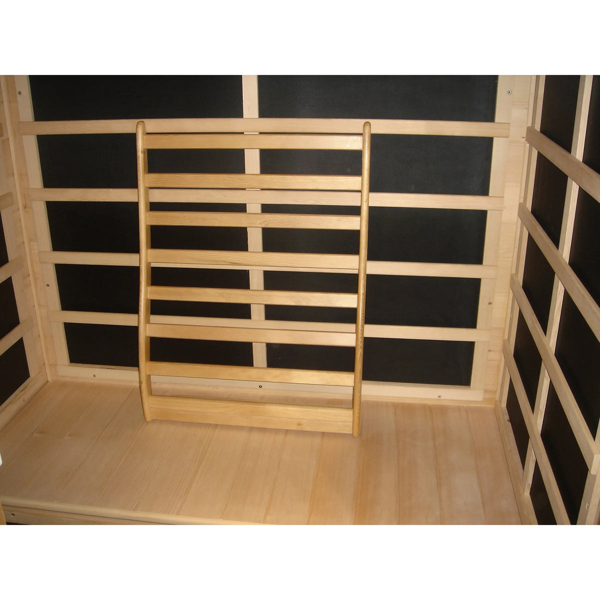 Wooden sauna backrest with lumbar support, vertical slats and curved top, light pine