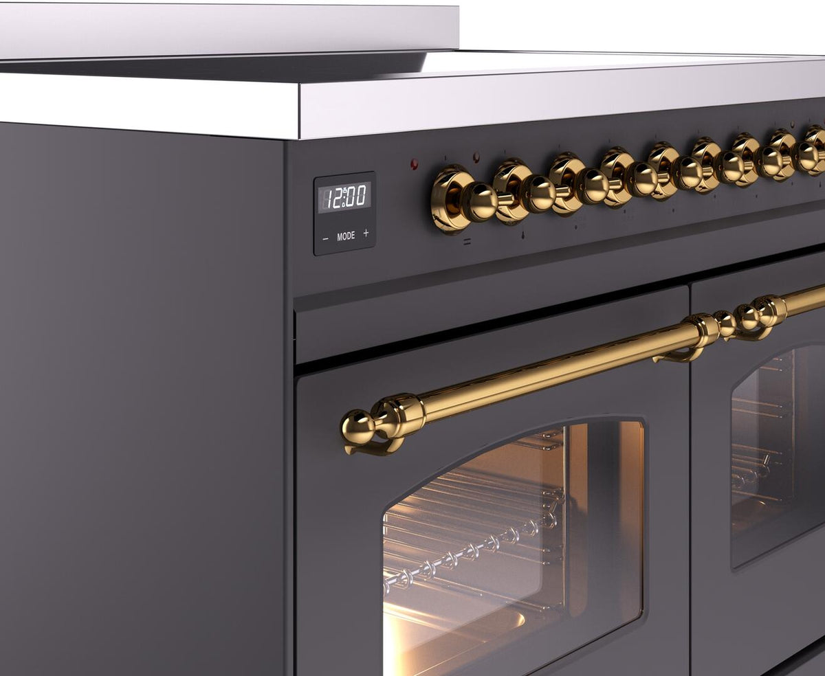 Freestanding electric induction range control panel with gold knobs and brass oven handle