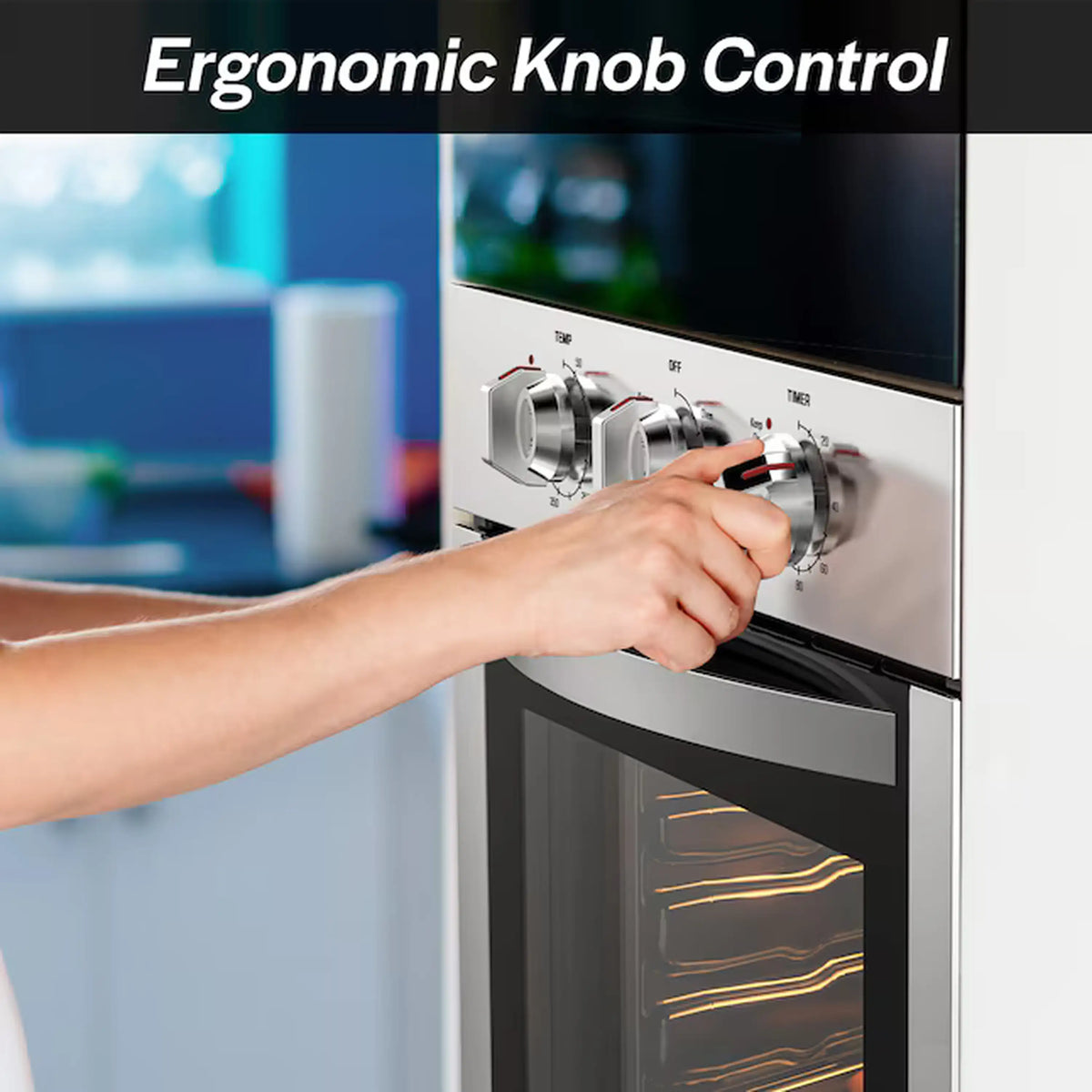 Stainless steel wall oven with ergonomic knob controls and interior heat glowing