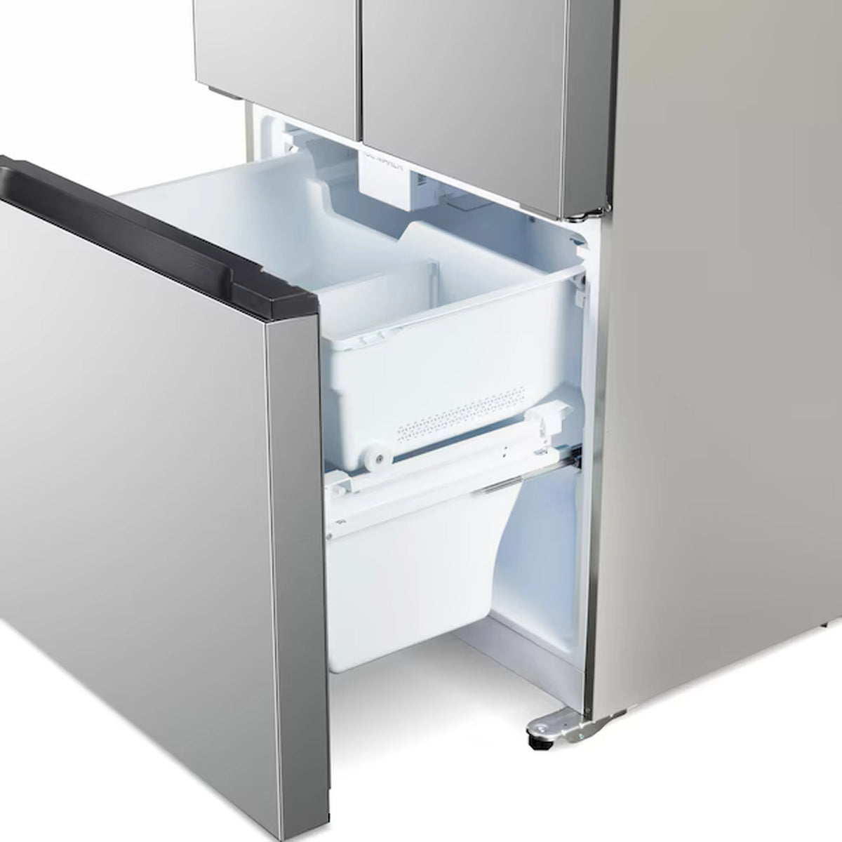 Stainless steel bottom freezer drawer open with empty white storage bin