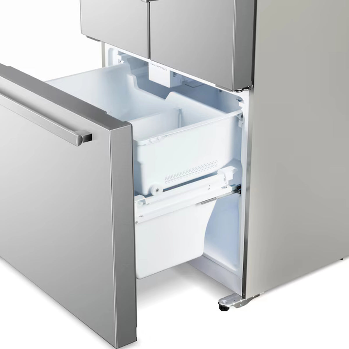 Stainless steel refrigerator freezer drawer open with white plastic bin