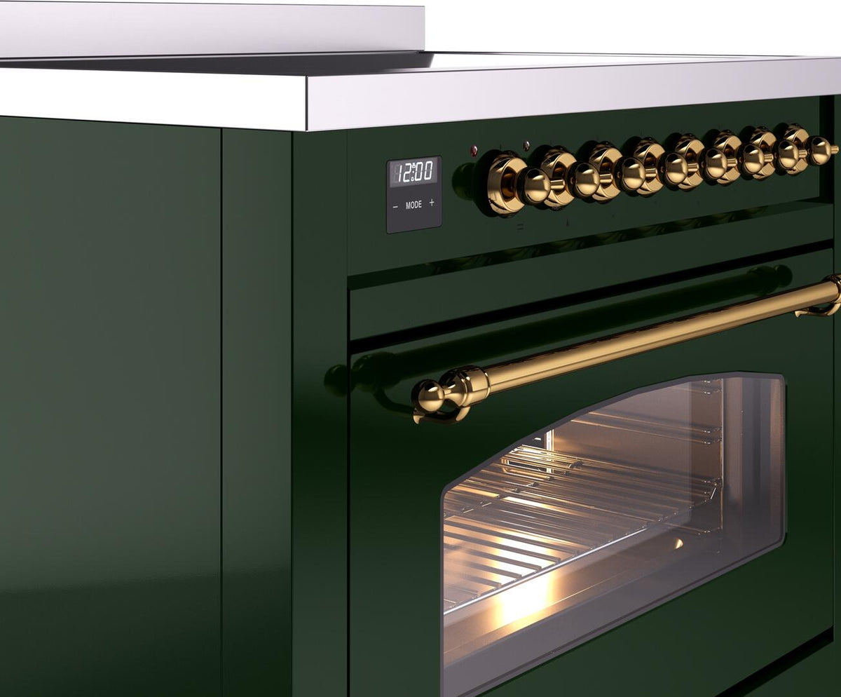 Induction range control area with brass rail handle and lit oven glass window