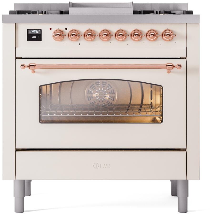 Antique white dual fuel range front with copper control knobs and oven door window