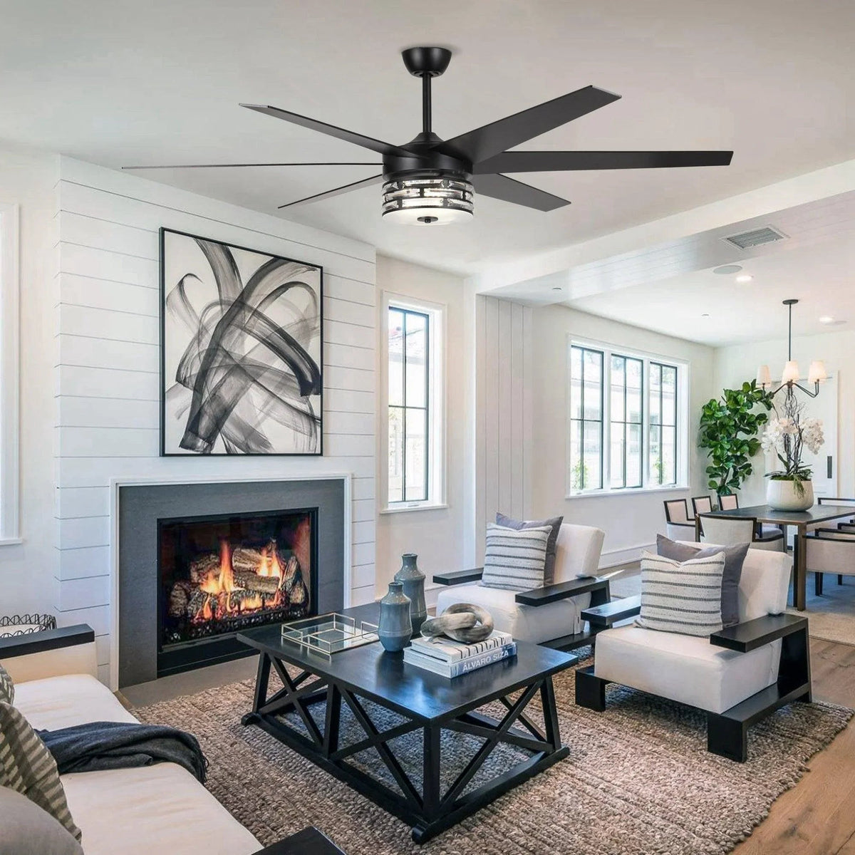 Black ceiling fan with lighting unit centered under the motor housing