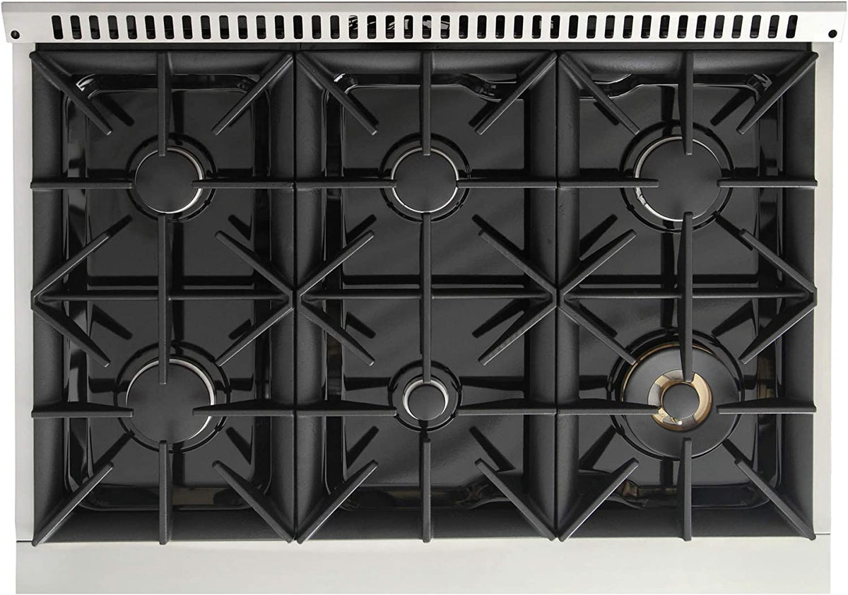 Gas cooktop underside view with black burner grates and circular burner heads