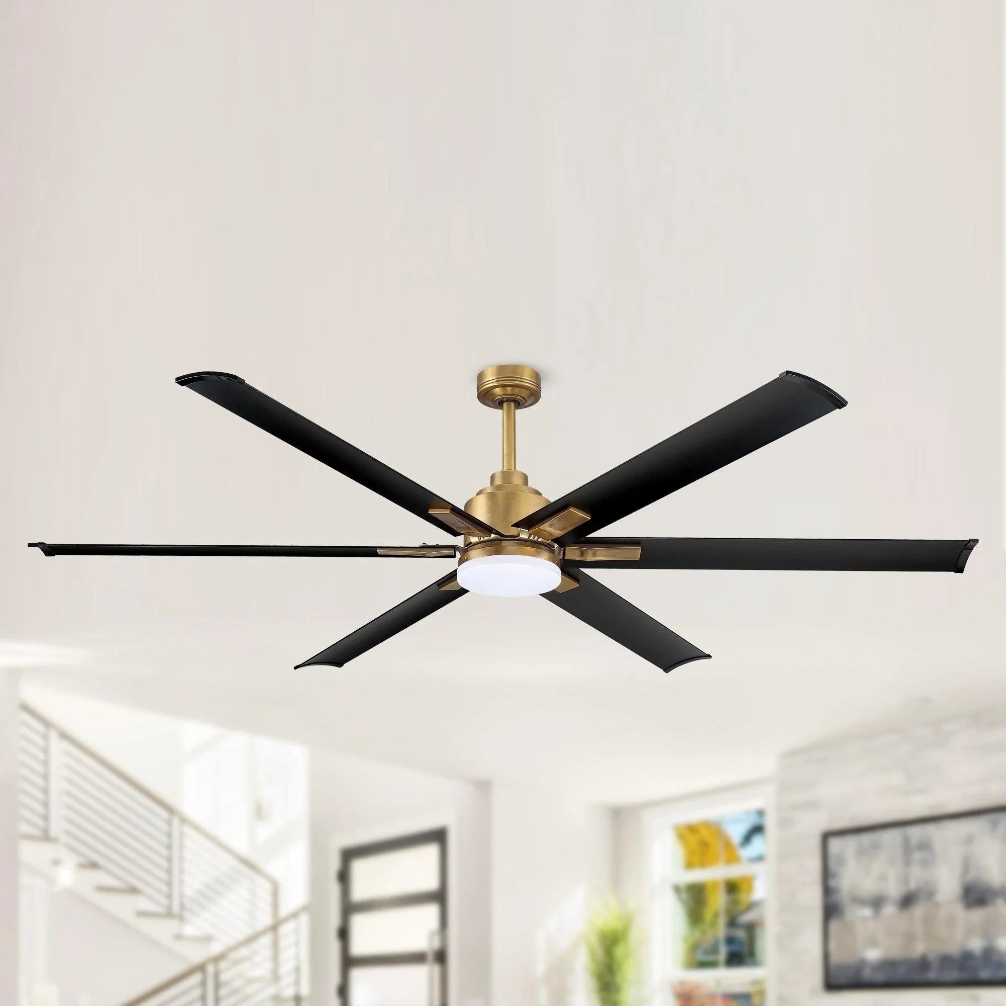 Gold ceiling fan with six black blades and frosted round light cover