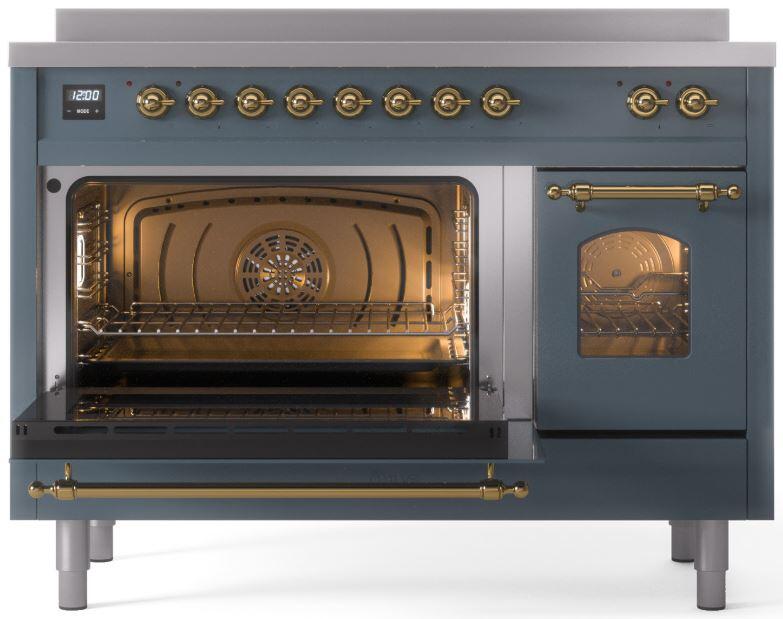Blue-grey induction range with left oven open and brass warming handle over racks