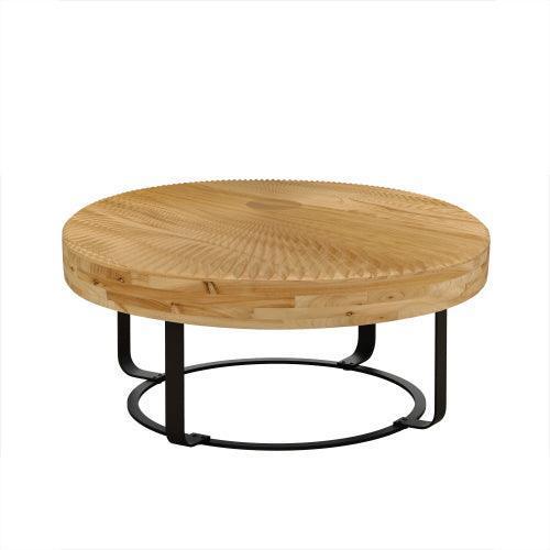 Round wooden coffee table with radial carved top and black arched metal legs.