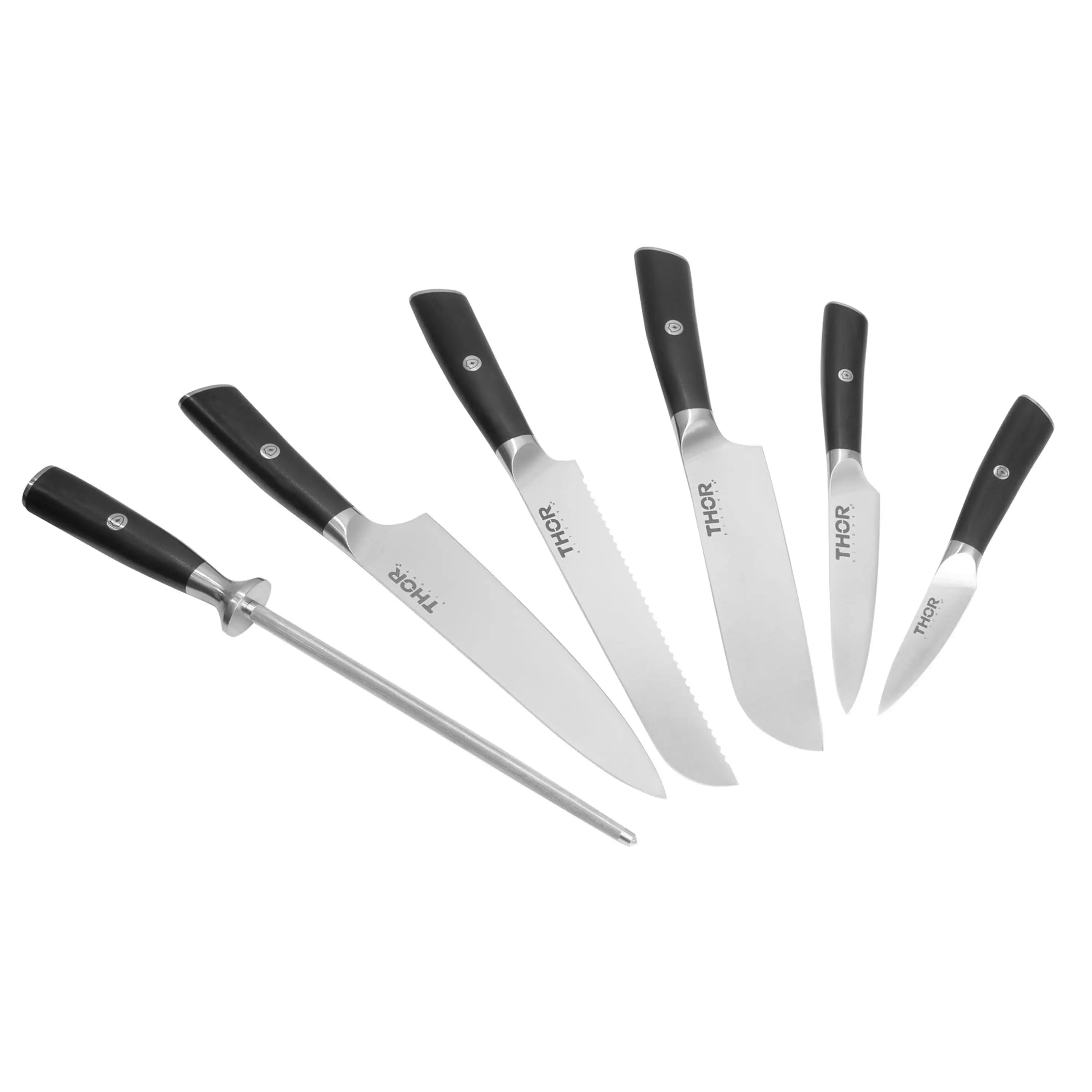 7-piece knife set laid out with black handles and stainless blades