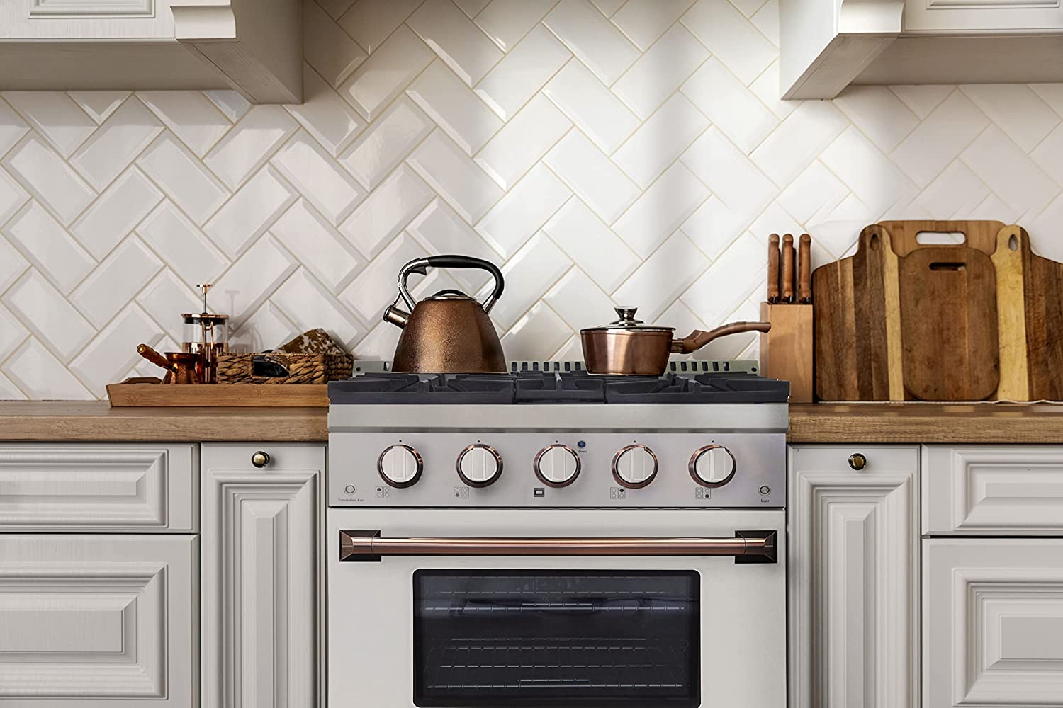 White Kucht 30-inch propane gas range with rose gold handle and black oven window