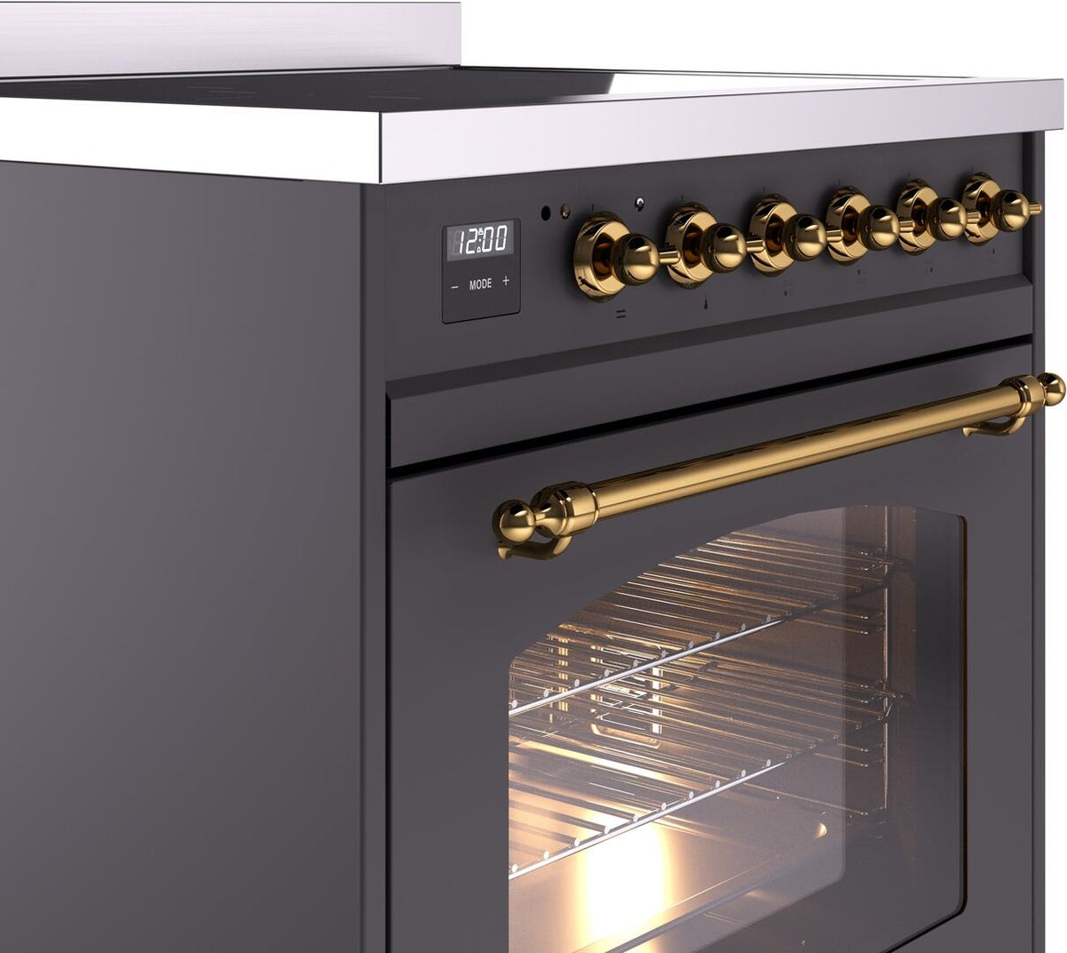 Matte graphite induction range control panel with brass knobs and brass oven handle