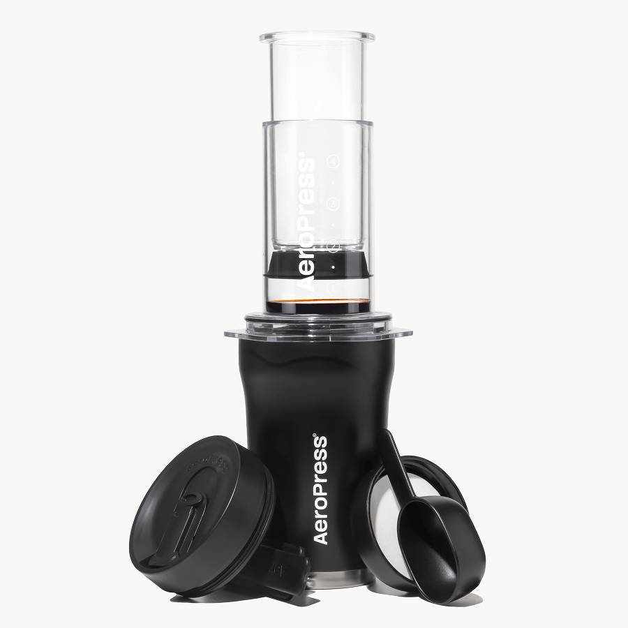 Black 3-in-1 AeroPress-style coffee maker with insulated tumbler, scoop, and lid