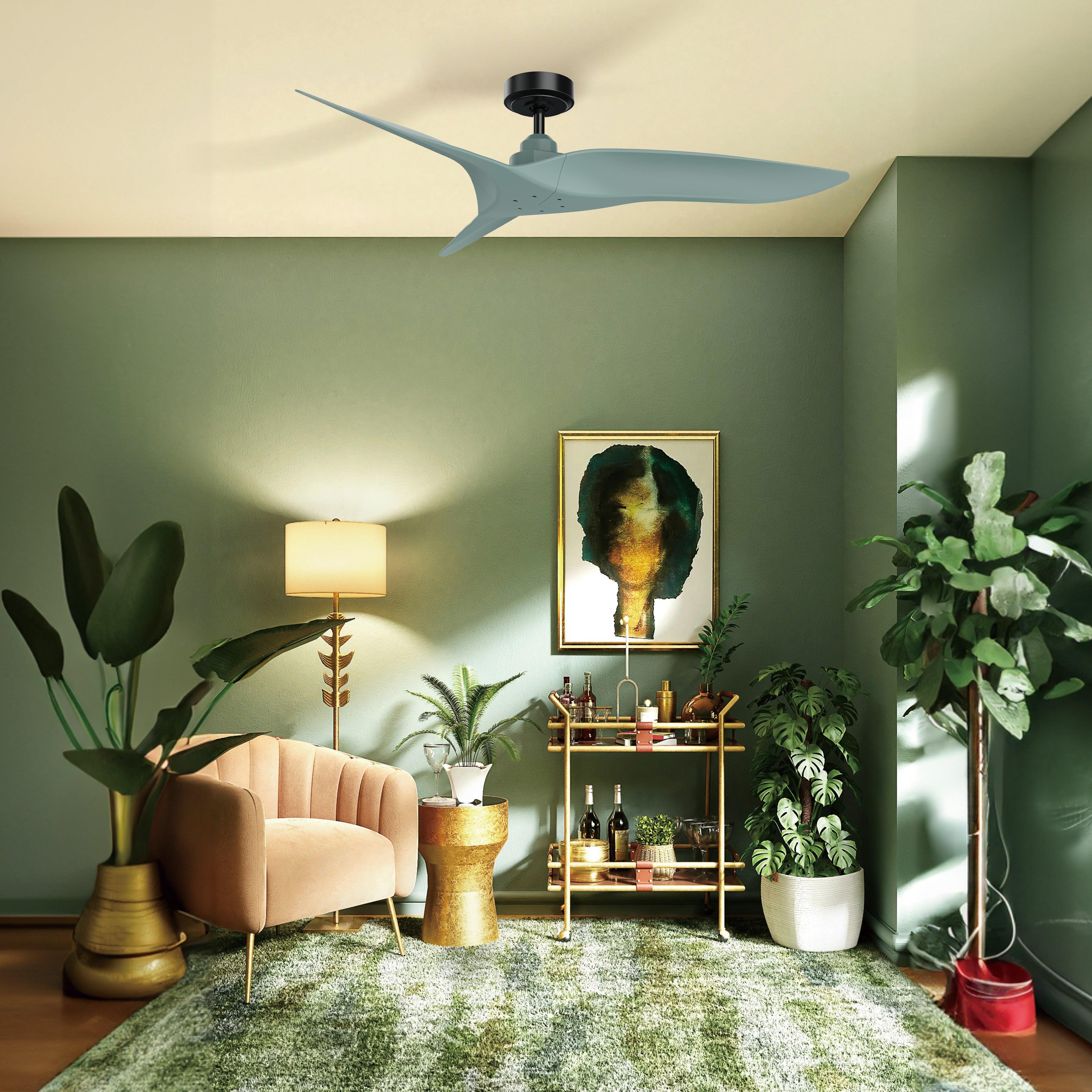 Light blue ceiling fan with three blades and dark motor housing in a green-themed room