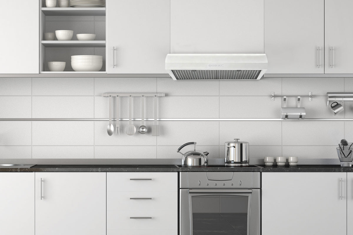 White under-cabinet range hood installed under kitchen cabinets, with metal filter grilles