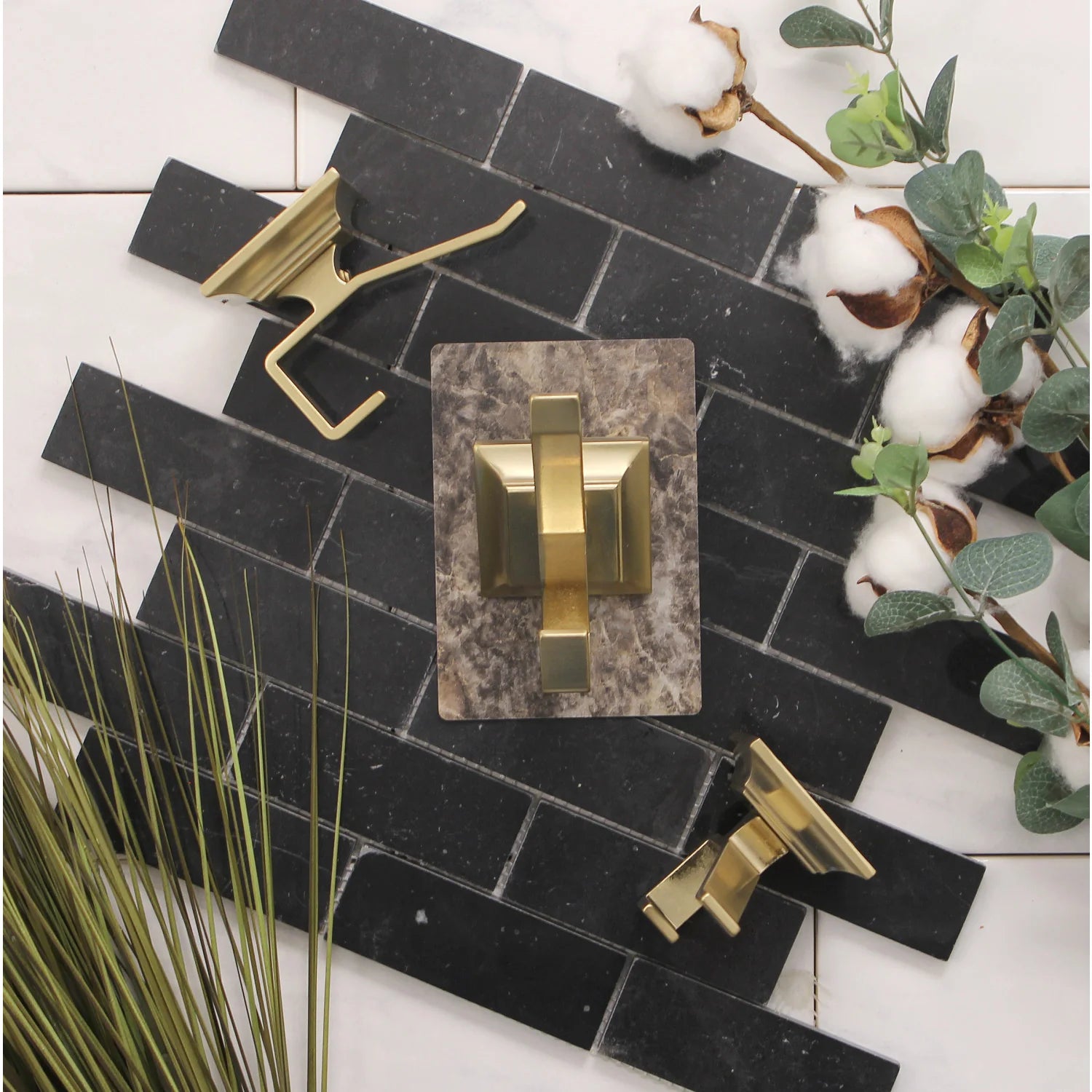 Brushed brass robe towel hooks mounted on bathroom wall tile, Monarch style