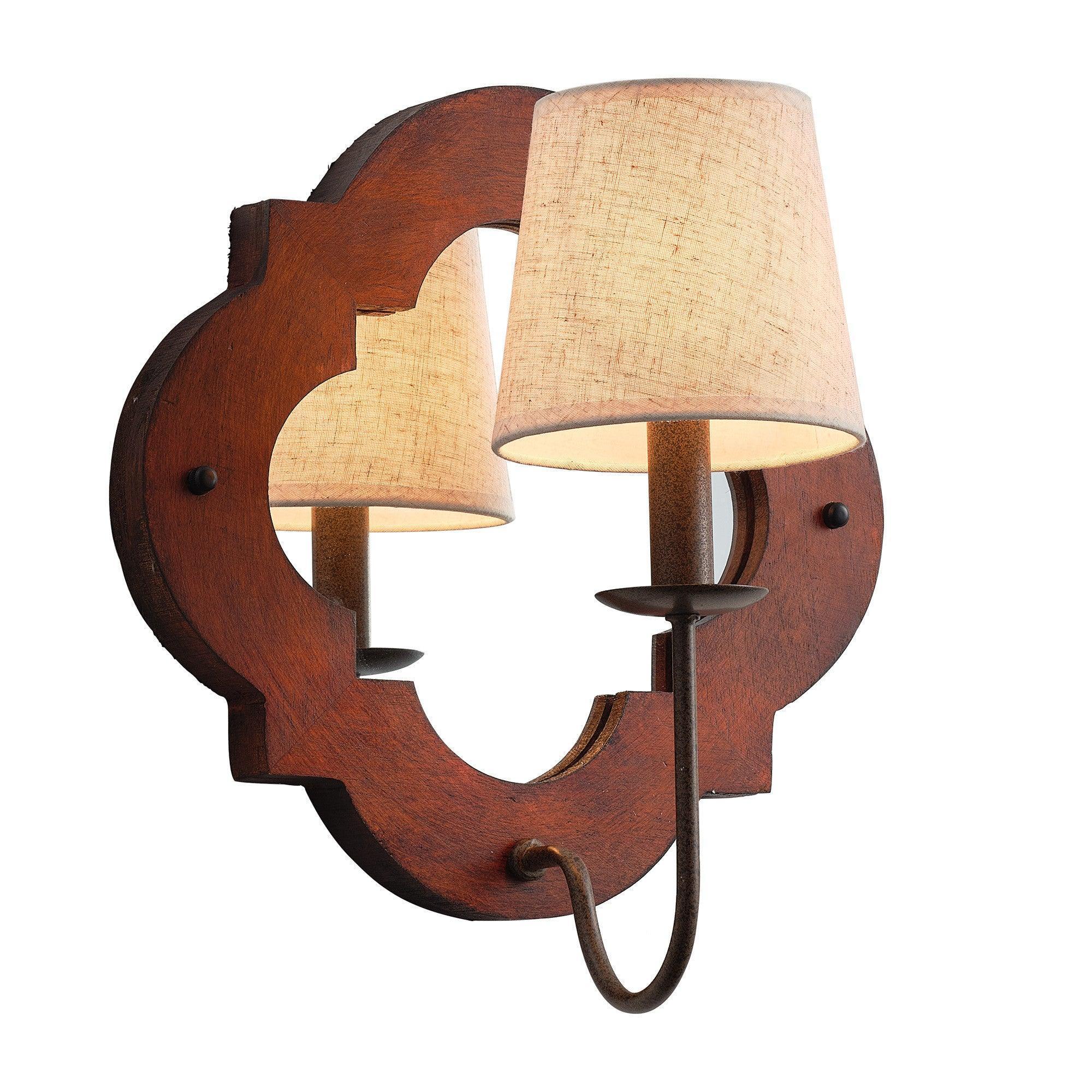 Rustic brown wood wall sconce with two beige fabric shades and curved metal connector