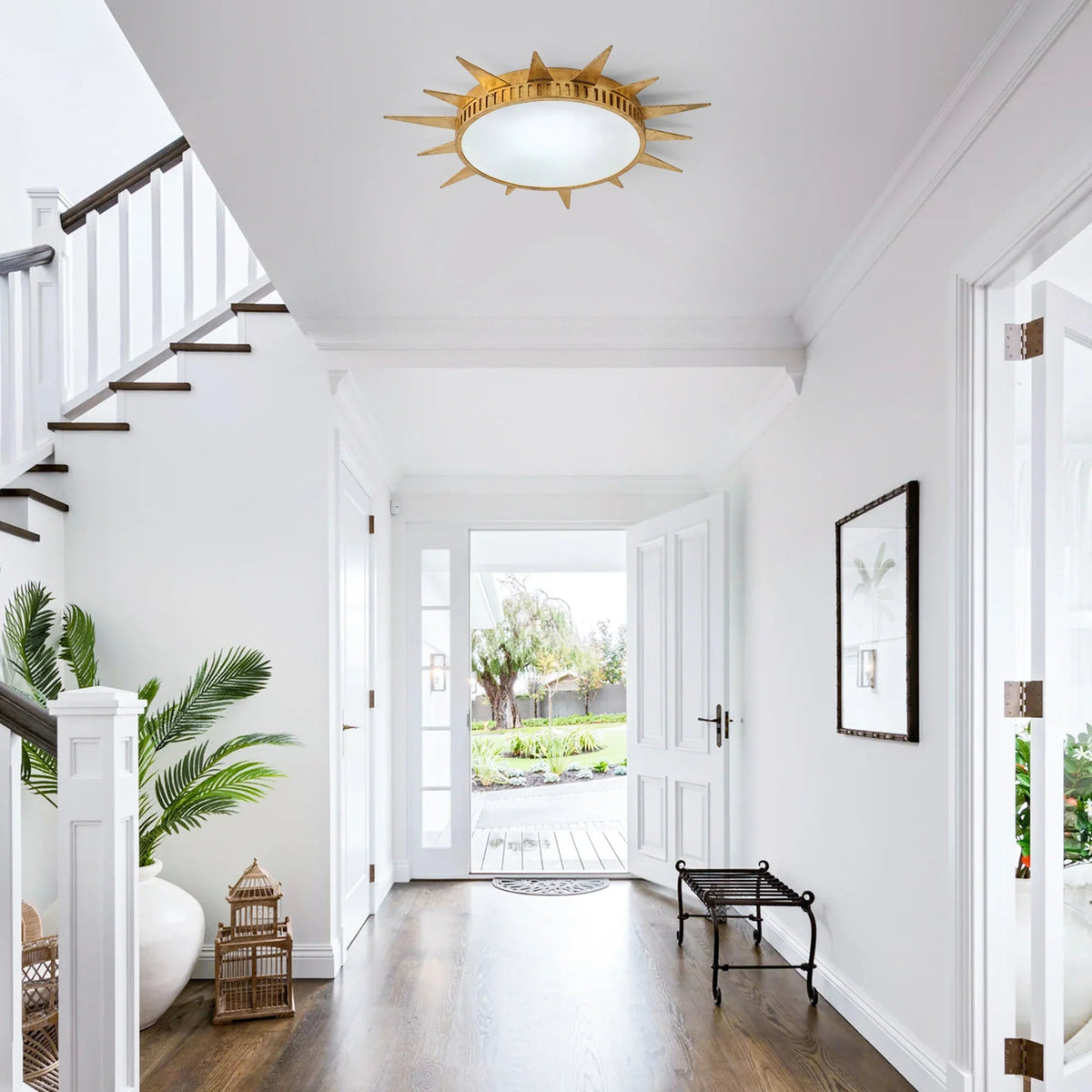 Golden sunburst flush-mount LED ceiling light with starburst frame and acrylic diffuser