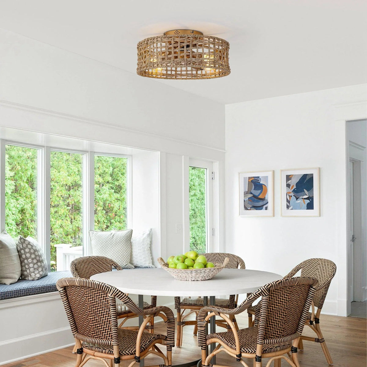 Golden rattan flush-mount ceiling fan with integrated light in a bright room setting.