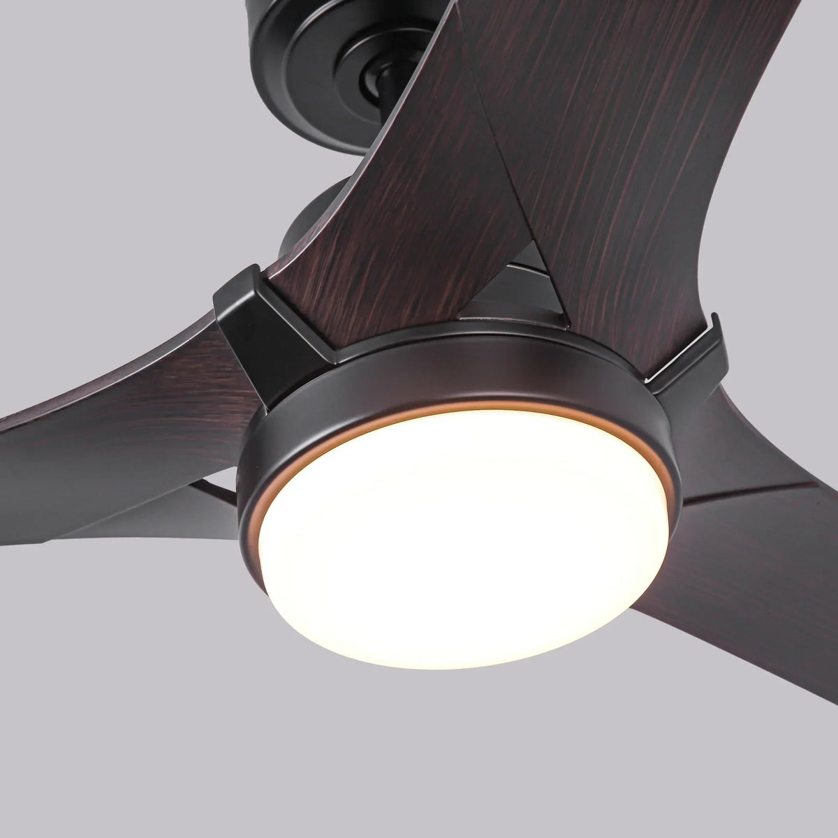 LED ceiling fan light with glowing glassless dome under dark wood blades